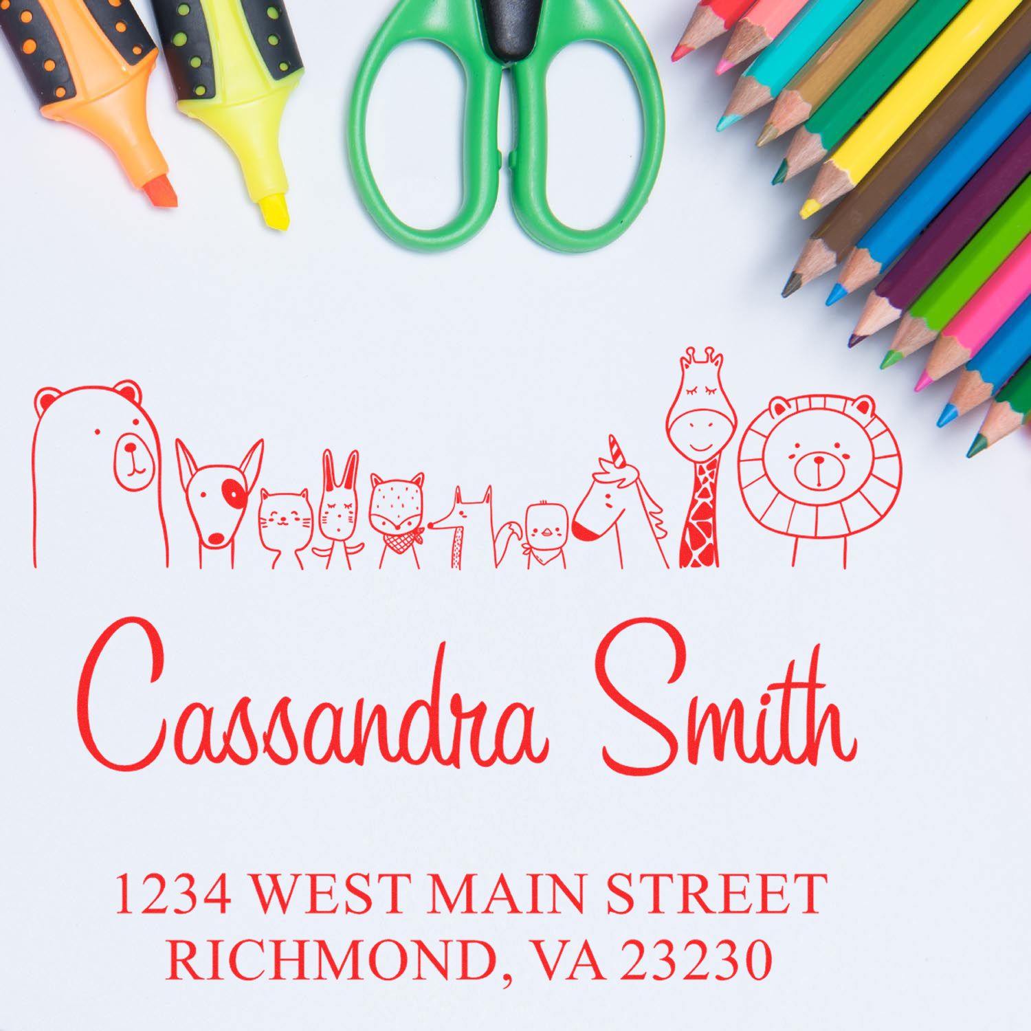 Self-Inking Cartoon Animal Zany Zoo Personalized Return Address Stamper featuring cute animal designs. Custom-Made New Address Stamp with the name "Cassandra Smith" and address "1234 West Main Street, Richmond, VA 23230" in red ink, surrounded by colorful stationery.