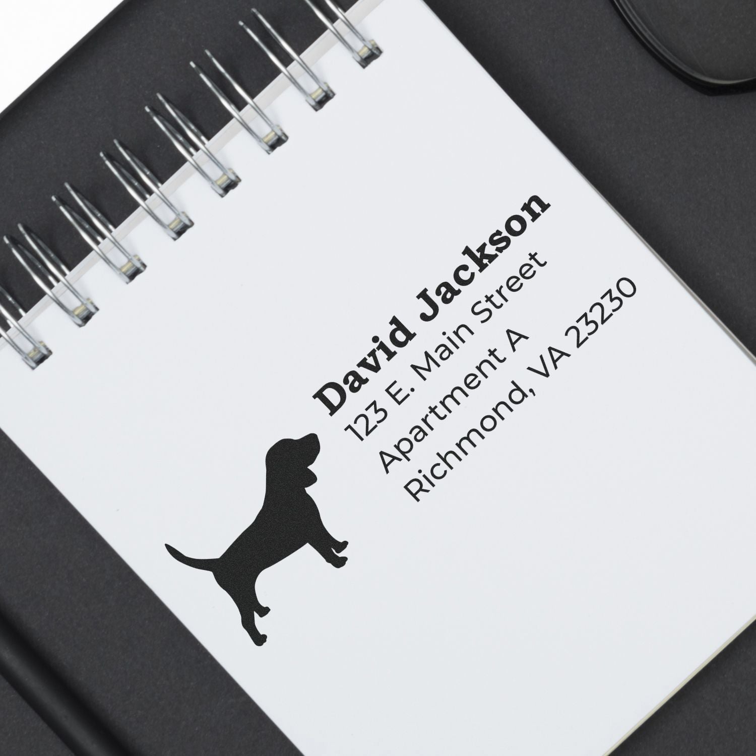 Beagle Silhouette Address Rubber Stamp on a notepad, featuring a beagle silhouette and sample address text in bold, black ink.