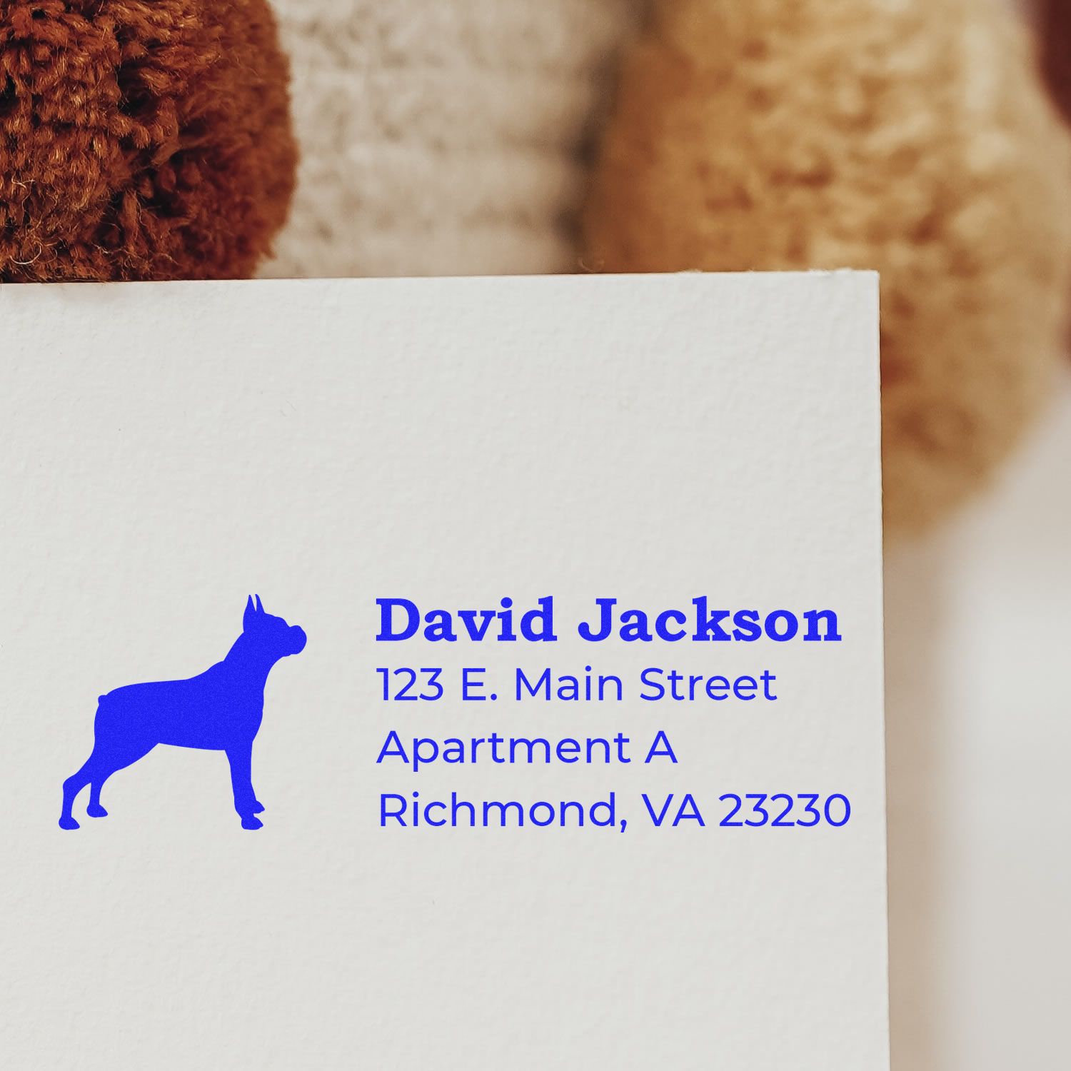 Self-Inking Boxer Dog Address Stamp on white paper, featuring a blue silhouette of a boxer dog and sample address text in bold blue font. Perfect for personalized mail and stationery.