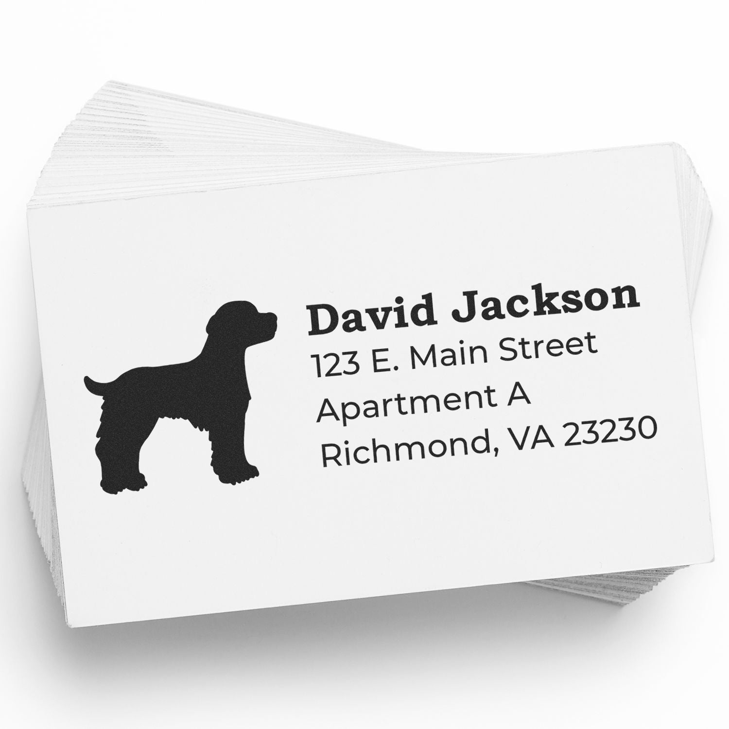 Self-Inking Brittany Spaniel Dog Address Stamp on a stack of white cards, featuring a silhouette of a Brittany Spaniel and sample address text.