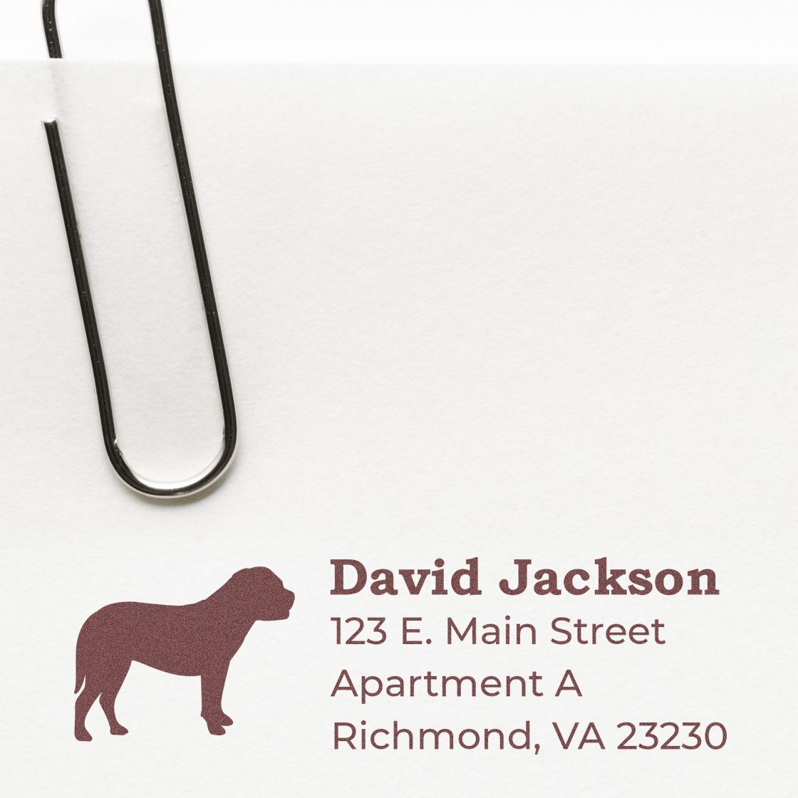 Self-Inking Bullmastiff Dog Address Stamp on white paper with a paperclip, featuring a silhouette of a Bullmastiff and sample address text in brown ink.