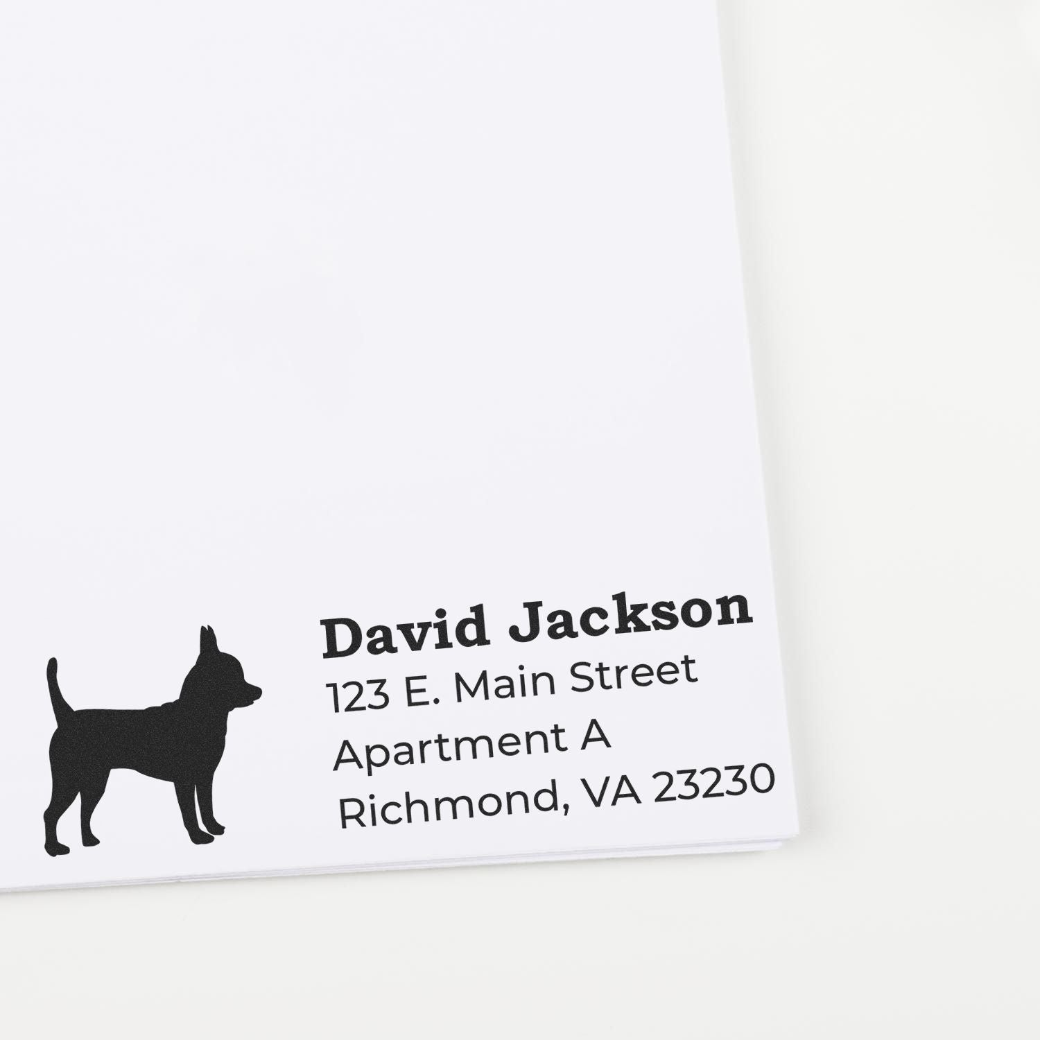 Self-Inking Chihuahua Dog Address Stamp on white paper, featuring a silhouette of a Chihuahua next to printed address details in bold black font. Perfect for adding a personal touch to mail.