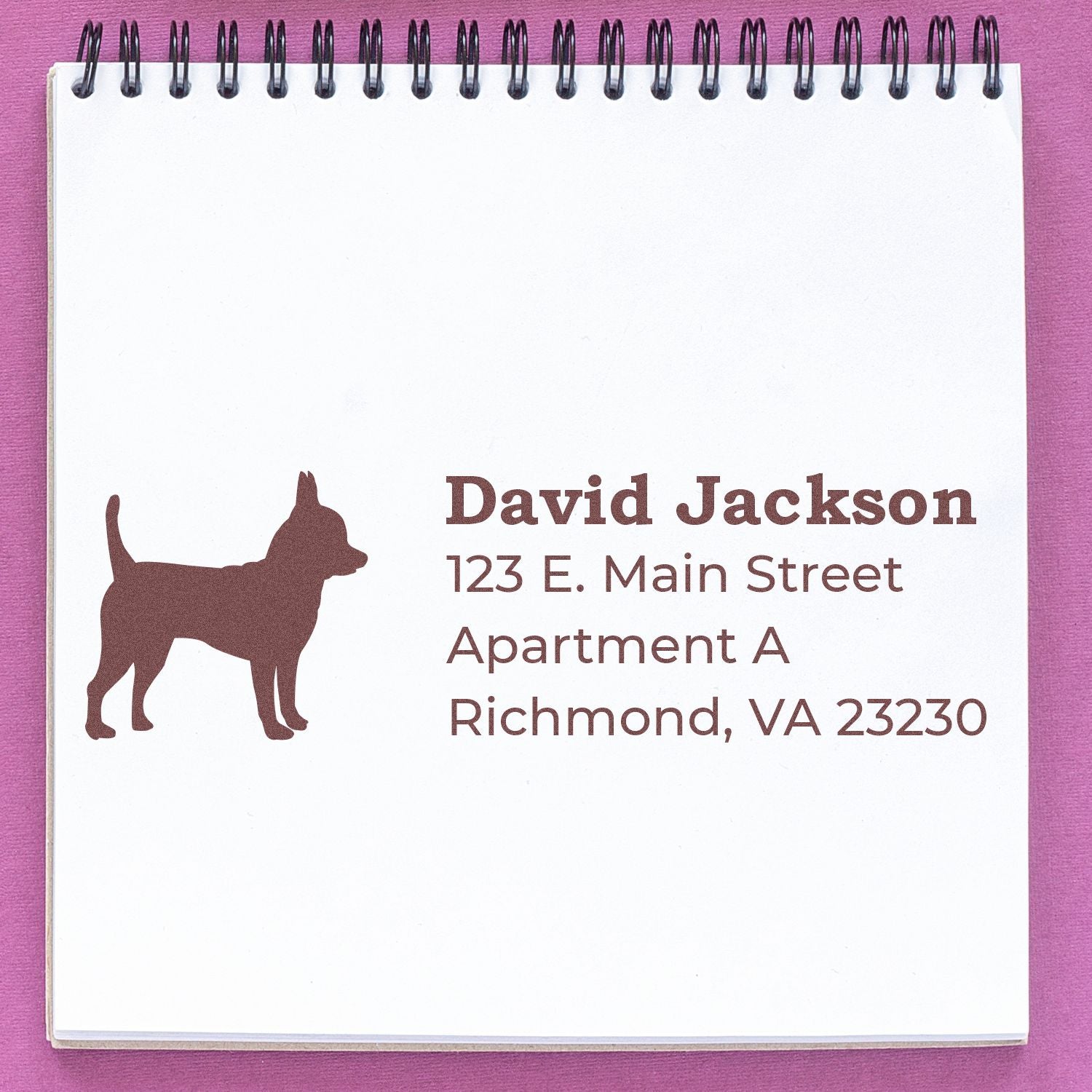 PSI Pre-Inked Personalized Chihuahua Address Stamp on a notepad, featuring a Chihuahua silhouette and sample address text in brown ink.