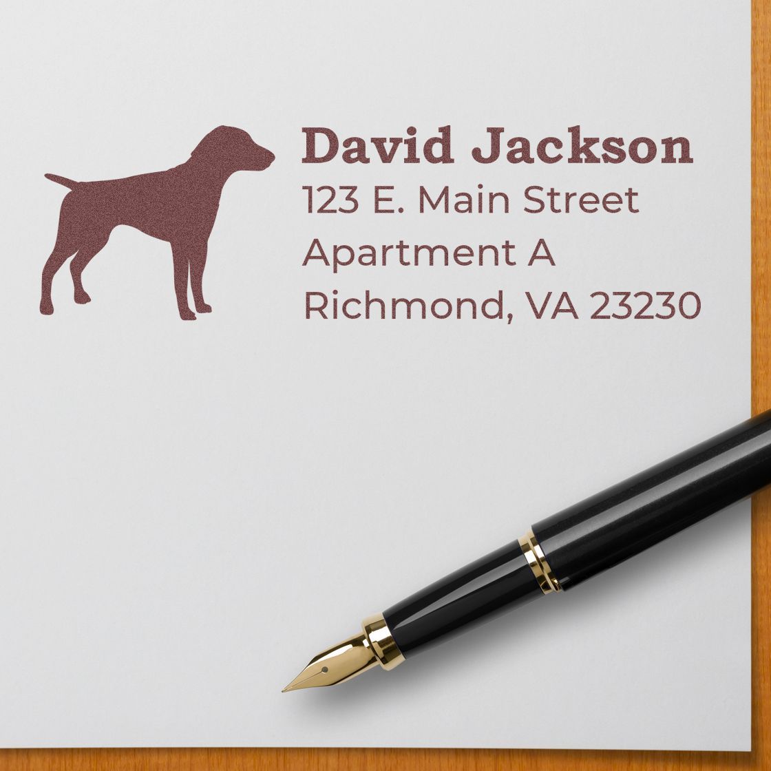 German Shorthaired Pointer Silhouette Address Rubber Stamp on paper with a pen. Features a dog silhouette and sample address text in elegant font. Ideal for personalized stationery.