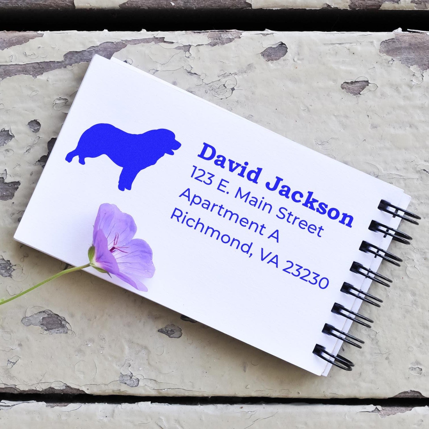 PSI Pre-Inked Personalized Pyrenean Mountain Dog Address Stamp on a notepad with a purple flower, showcasing a blue dog silhouette and address details in bold text.