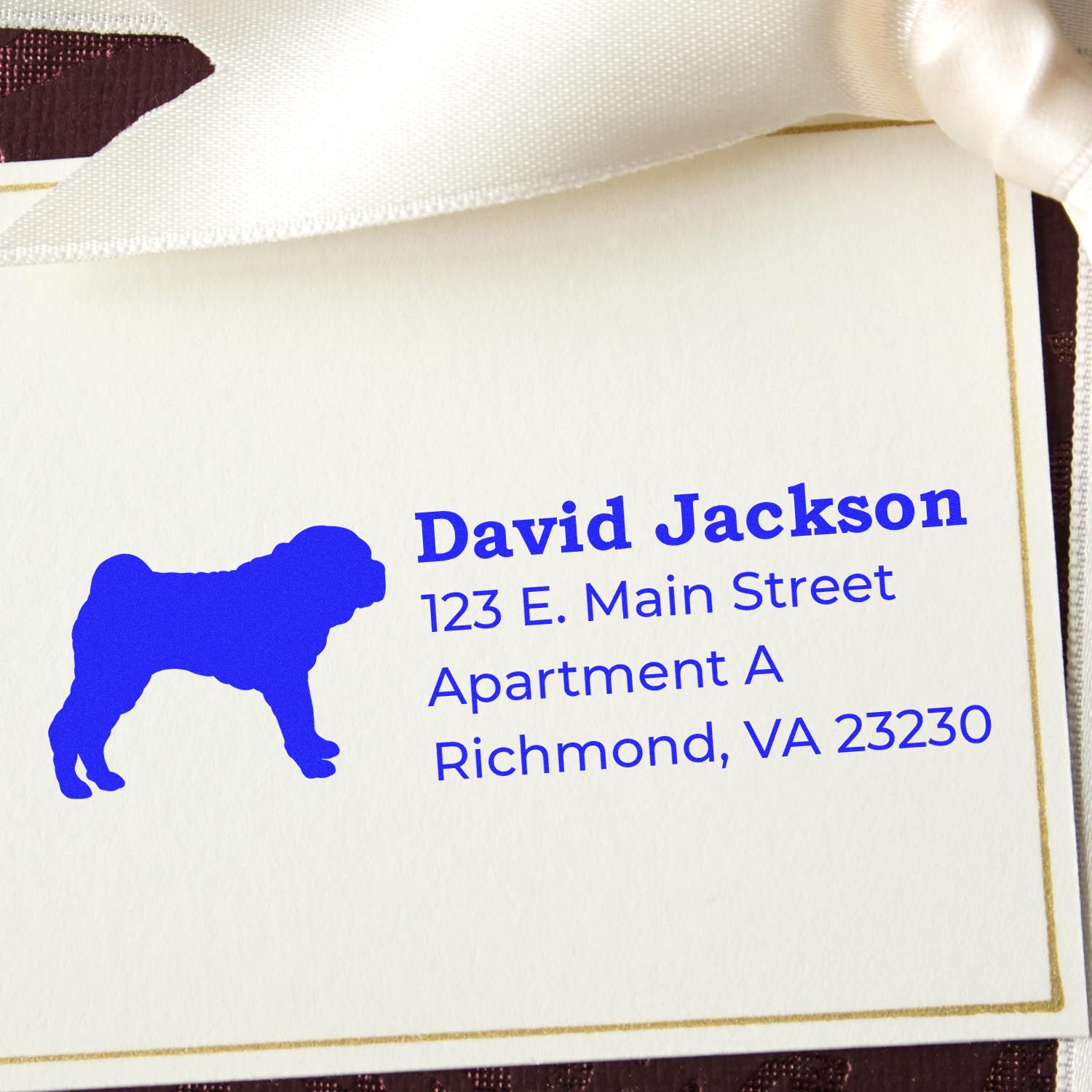 Self-Inking Shar Pei Dog Address Stamp on a card with blue text and a Shar Pei silhouette, featuring a sample address in Richmond, VA, tied with a white ribbon.