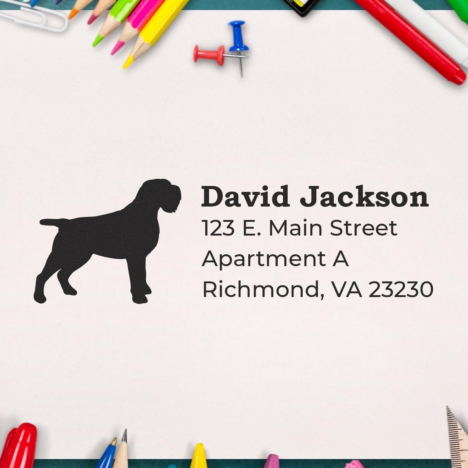 Self-Inking Wirehaired Pointing Griffon Dog Address Stamp on paper with colorful stationery around. Features a silhouette of the dog and sample address text.