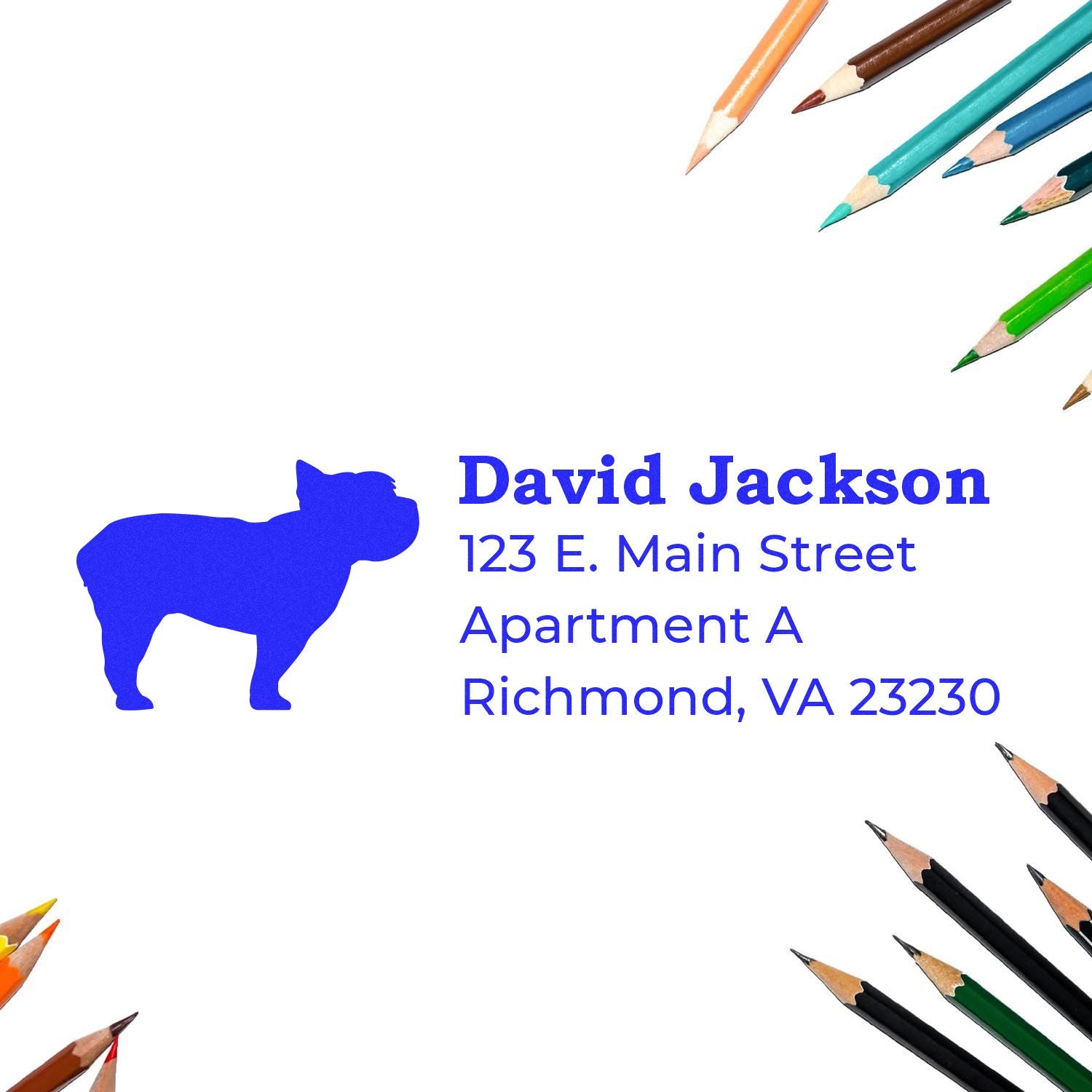 Self-Inking Yorkshire Terrier Dog Address Stamp on white paper, surrounded by colorful pencils. Blue silhouette of a dog next to printed address details.