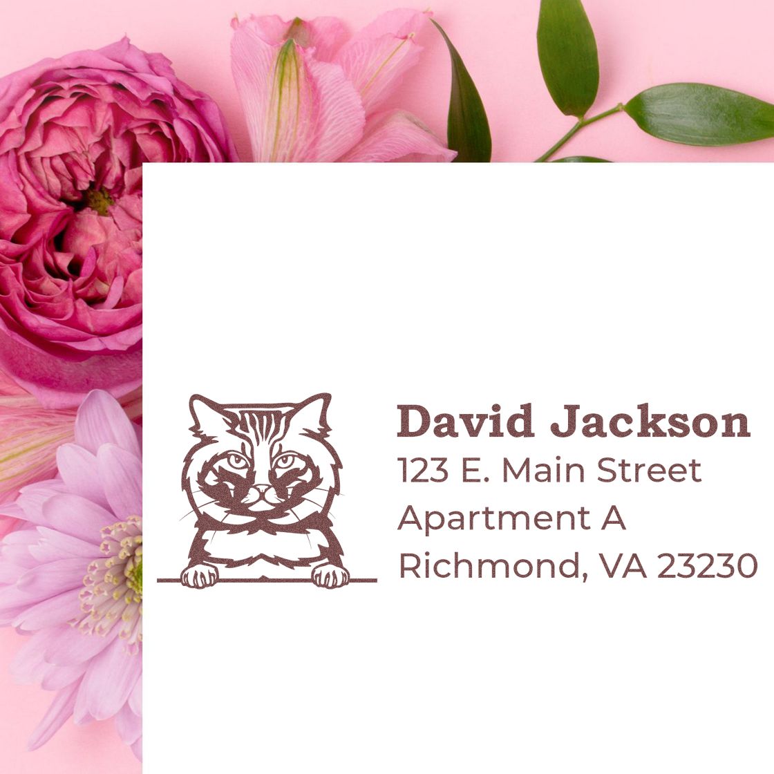 Wood Handle American Bobtail Cat Address Stamp on white paper, featuring a cat illustration and address text. Background includes pink flowers for a decorative touch.