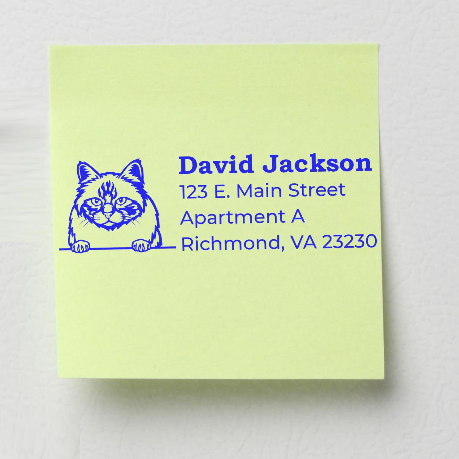 Slim Pre-Inked Birman Peeking Cat Return Address Stamp on a yellow note, featuring a blue Birman cat illustration with address details in bold text.