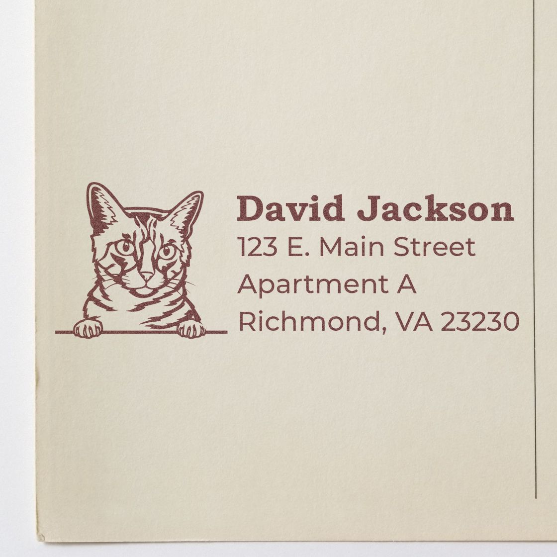 PSI Pre-Inked Peeking California Spangled Cat Personalized Address Stamp on beige paper, featuring a cat illustration and sample address text in brown ink.