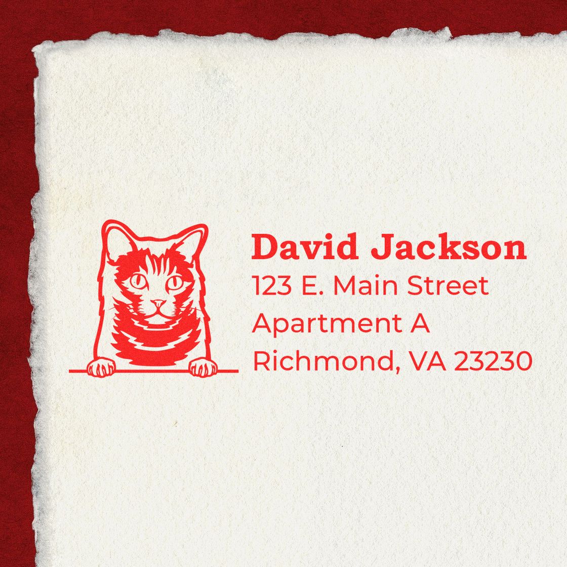 Wood Handle Chartreux Cat Address Stamp on paper, featuring a red cat illustration and sample address text in red ink on a textured background.