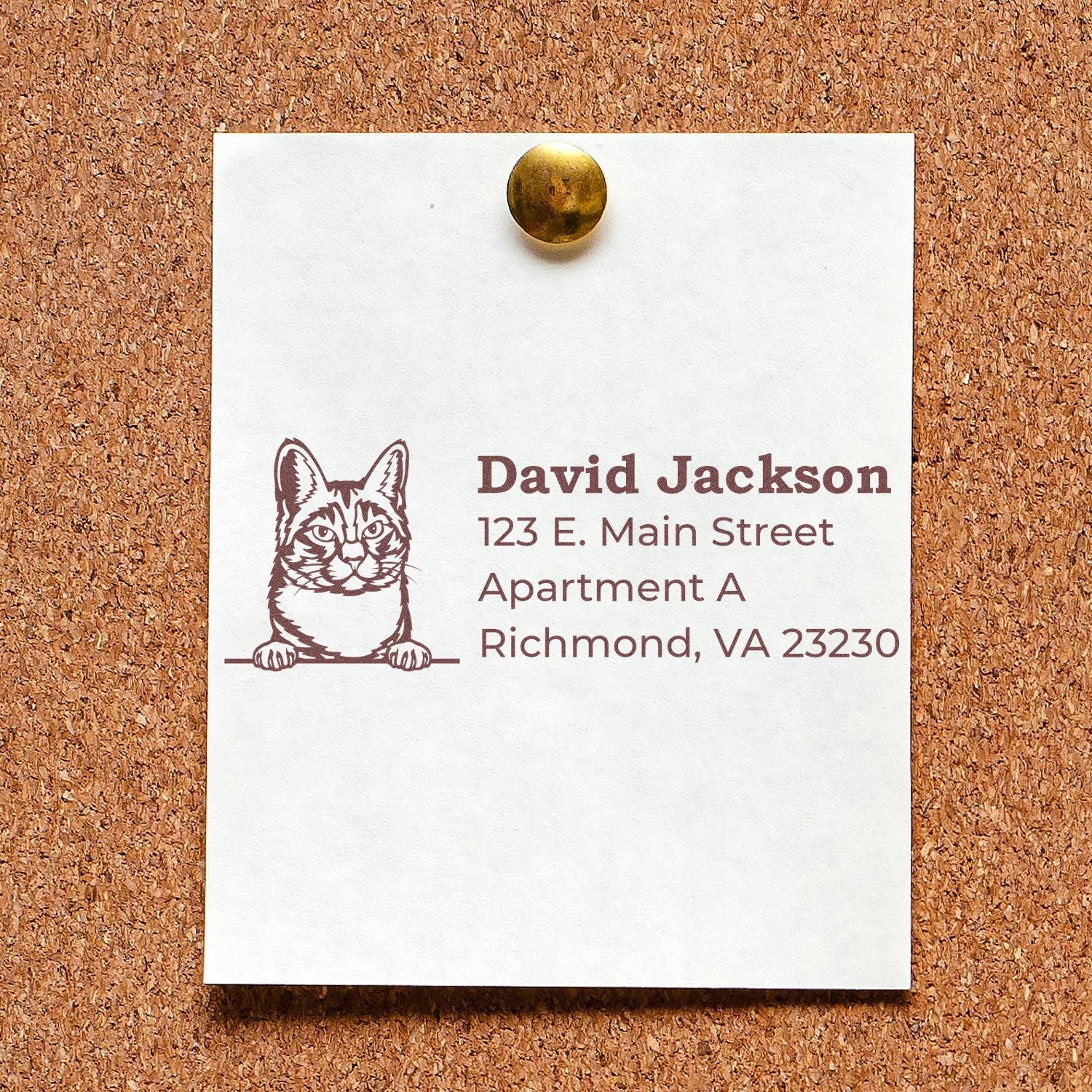 Wood Handle Manx Cat Address Stamp on a corkboard, featuring a Manx cat illustration and sample address details in brown ink.