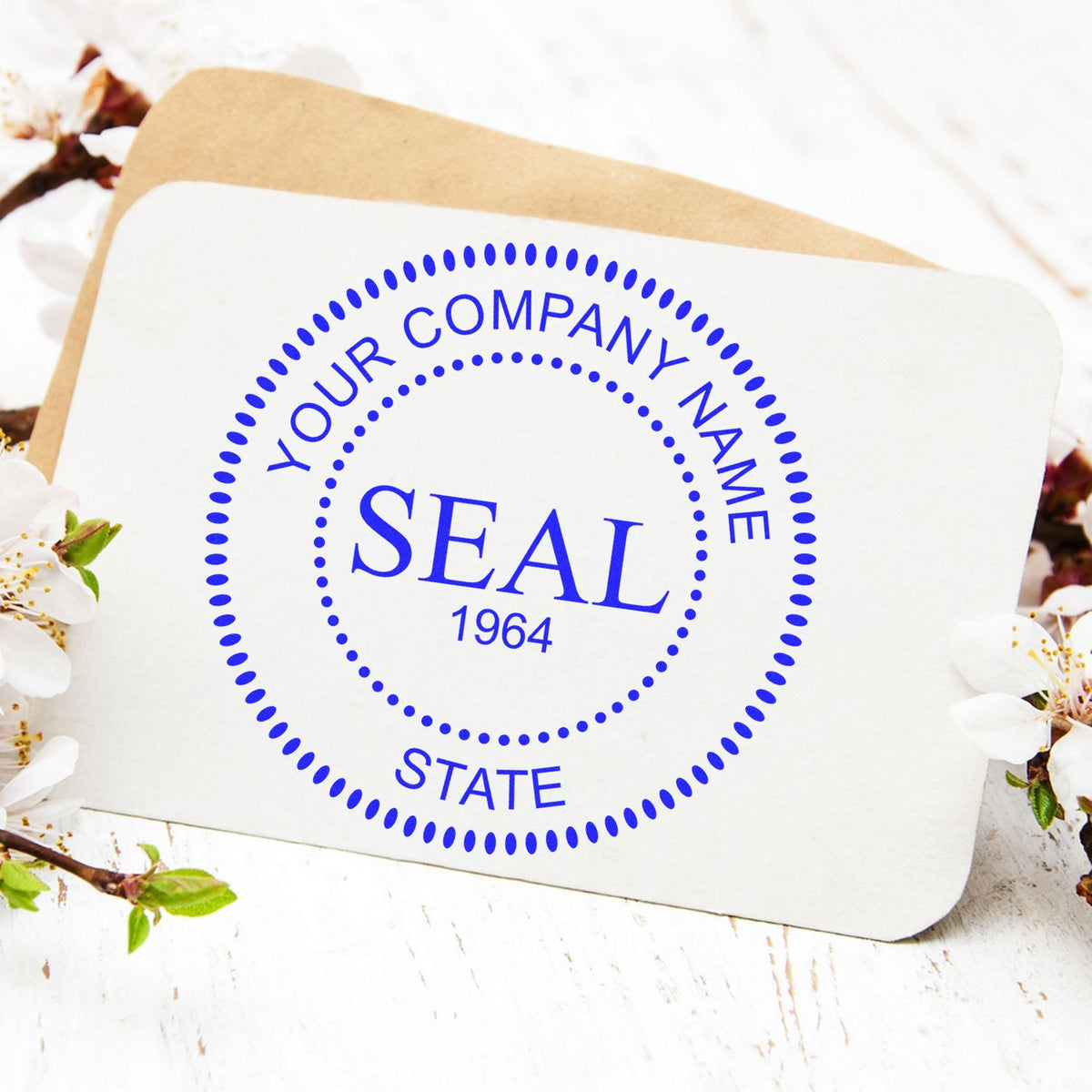 Blue custom company seal stamp on white card with tan backing, reading Your Company Name Seal 1964 State.
