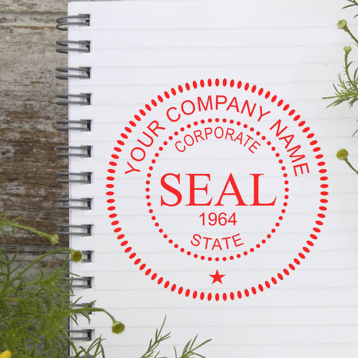Custom red corporate seal stamp with dotted border and star on white spiral notebook, stamp and seal product.