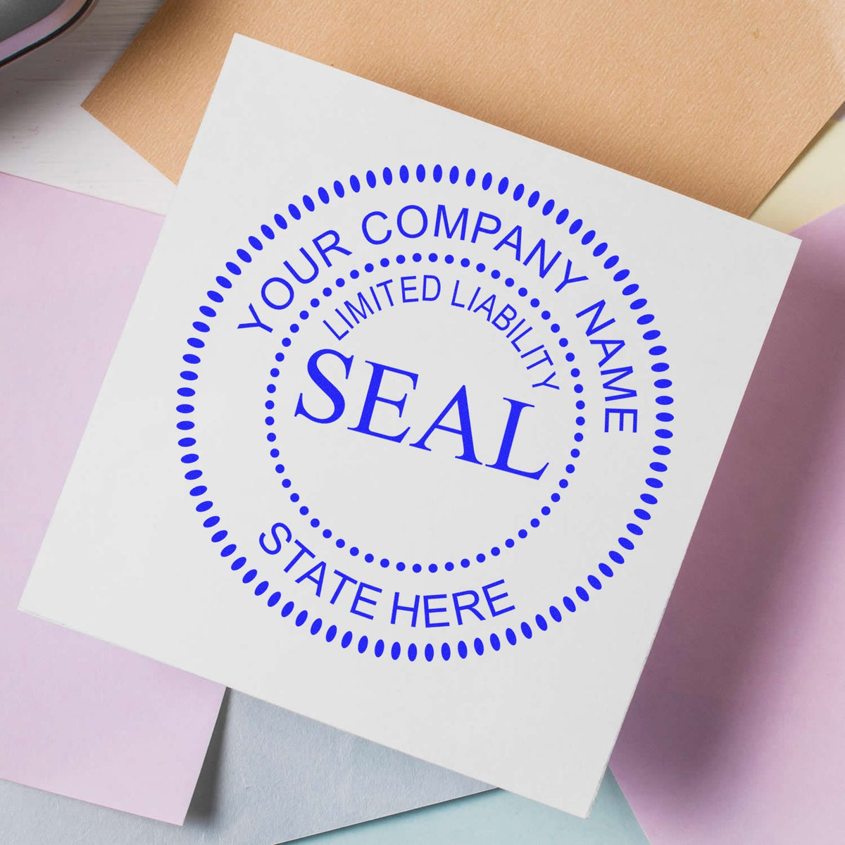 Blue custom company seal stamp on white card, with dotted circle and YOUR COMPANY NAME and LIMITED LIABILITY text.