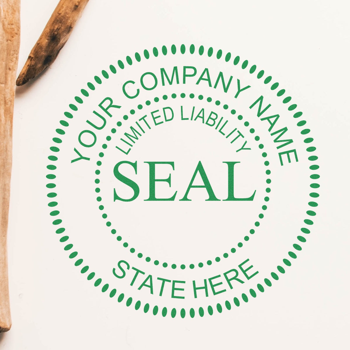Green custom company seal stamp with dotted circular border and white text on a white background, with wooden handles visible.