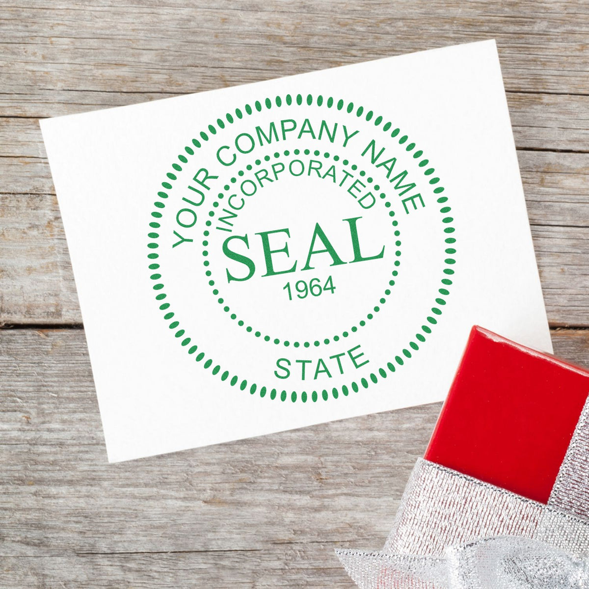 Green corporate seal on white card with red self-inking stamp, set on rustic wood background.