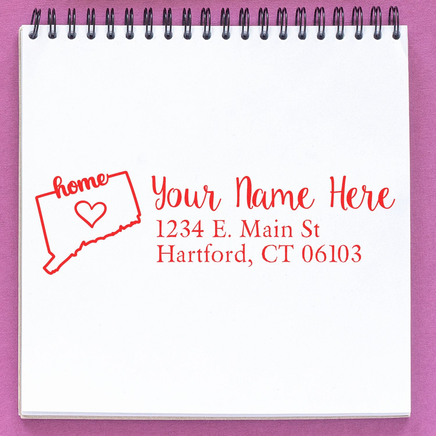 PSI Pre-Inked Personalized Connecticut State Love Address Stamp on a notepad, featuring a red outline of Connecticut with a heart and customizable address text.