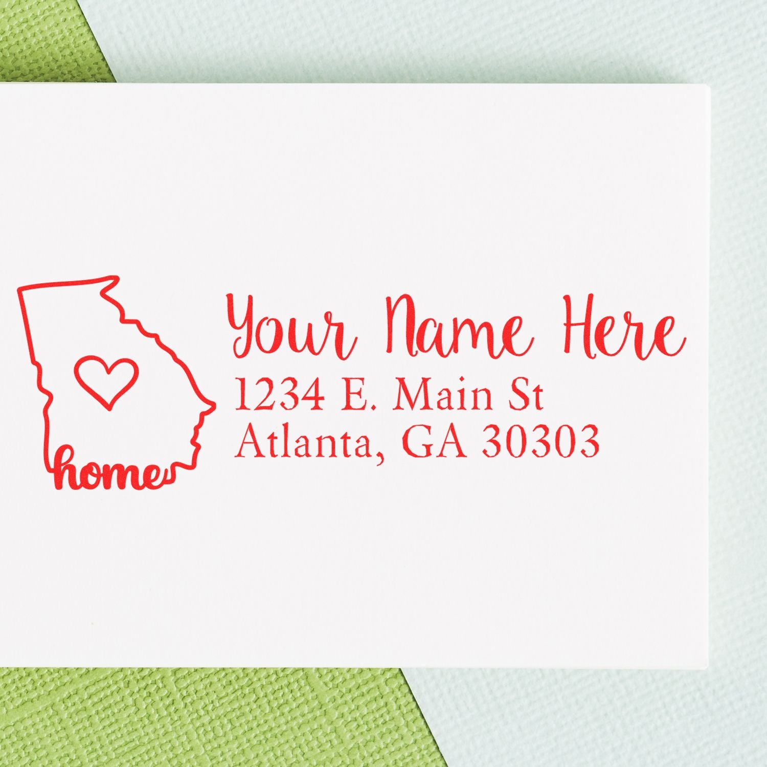 Wood Handle Georgia Custom Address Rubber Stamp imprint on white paper, featuring a red outline of Georgia with a heart and the word home, alongside customizable address text in elegant script.