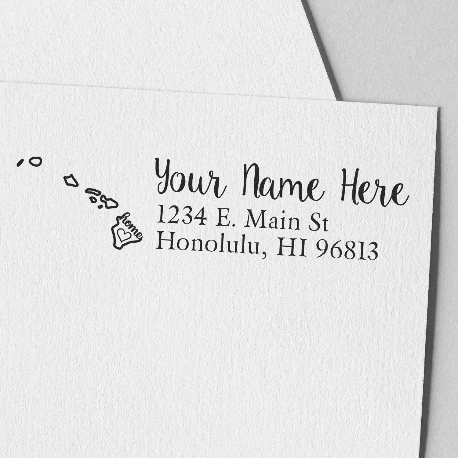 Hawaii Self-Inking State Love Address Stamp on white paper, featuring a heart design with home text and sample address: 1234 E. Main St, Honolulu, HI 96813.