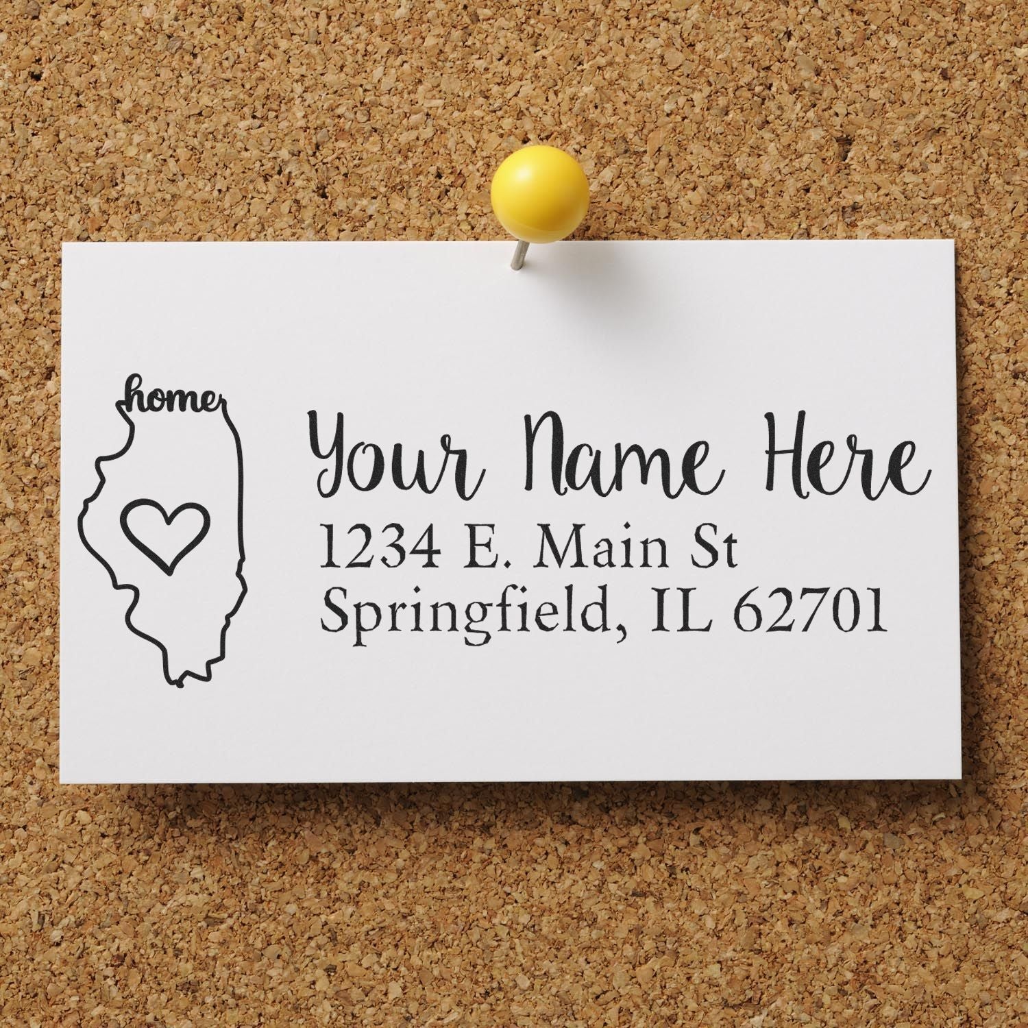 PSI Pre-Inked Personalized Illinois State Love Address Stamp on a corkboard, featuring a heart inside the Illinois outline and customizable address text.