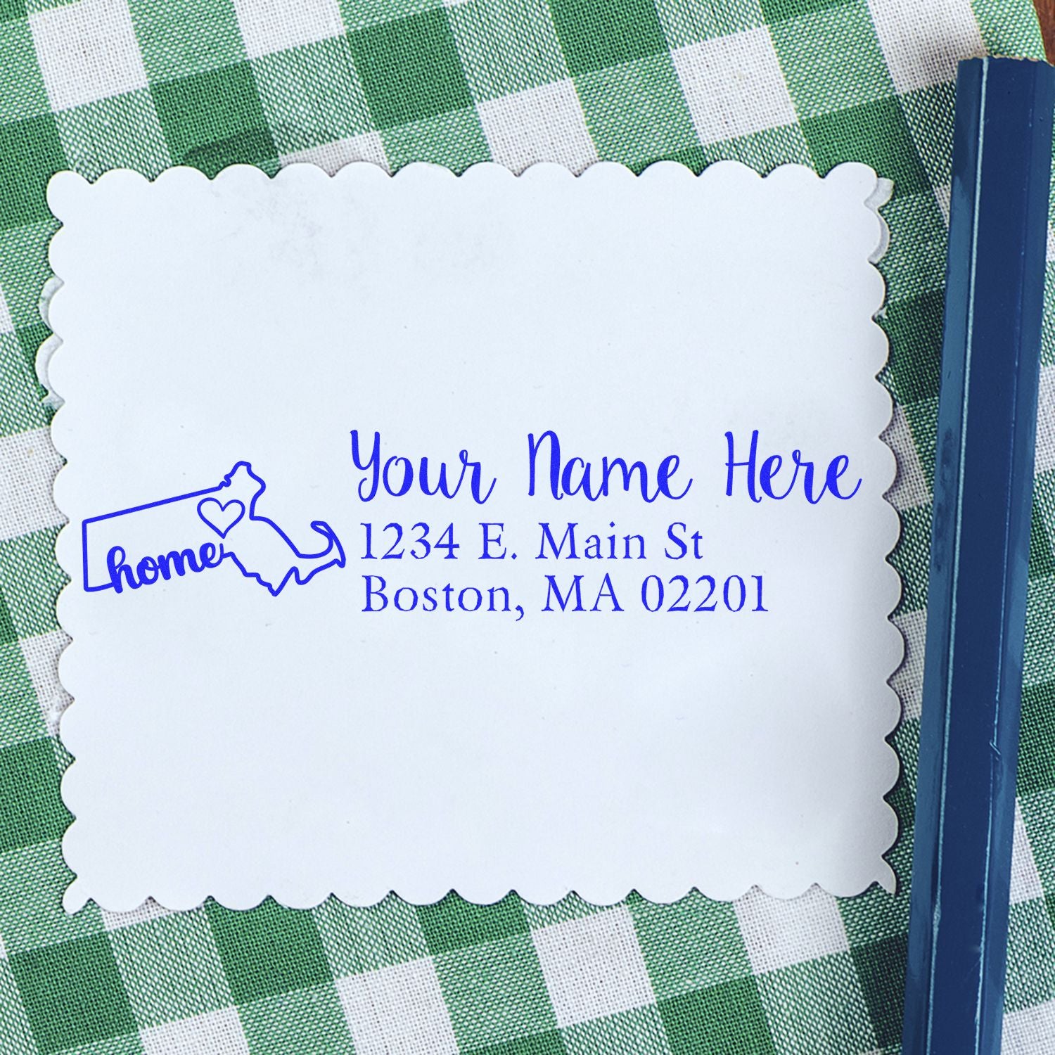 Massachusetts Self-Inking State Love Address Stamp on a scalloped card with a green checkered background, featuring a heart and home text, ideal for personalizing mail with a Boston address.