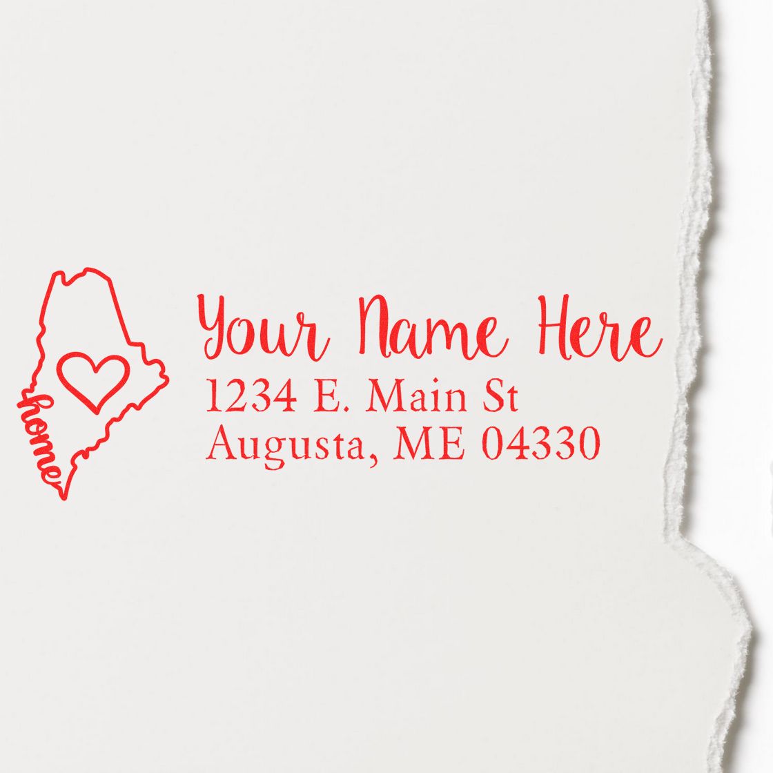 Red Maine Self-Inking State Love Address Stamp on white paper, featuring a heart inside the state outline and customizable address text: Your Name Here, 1234 E. Main St, Augusta, ME 04330.