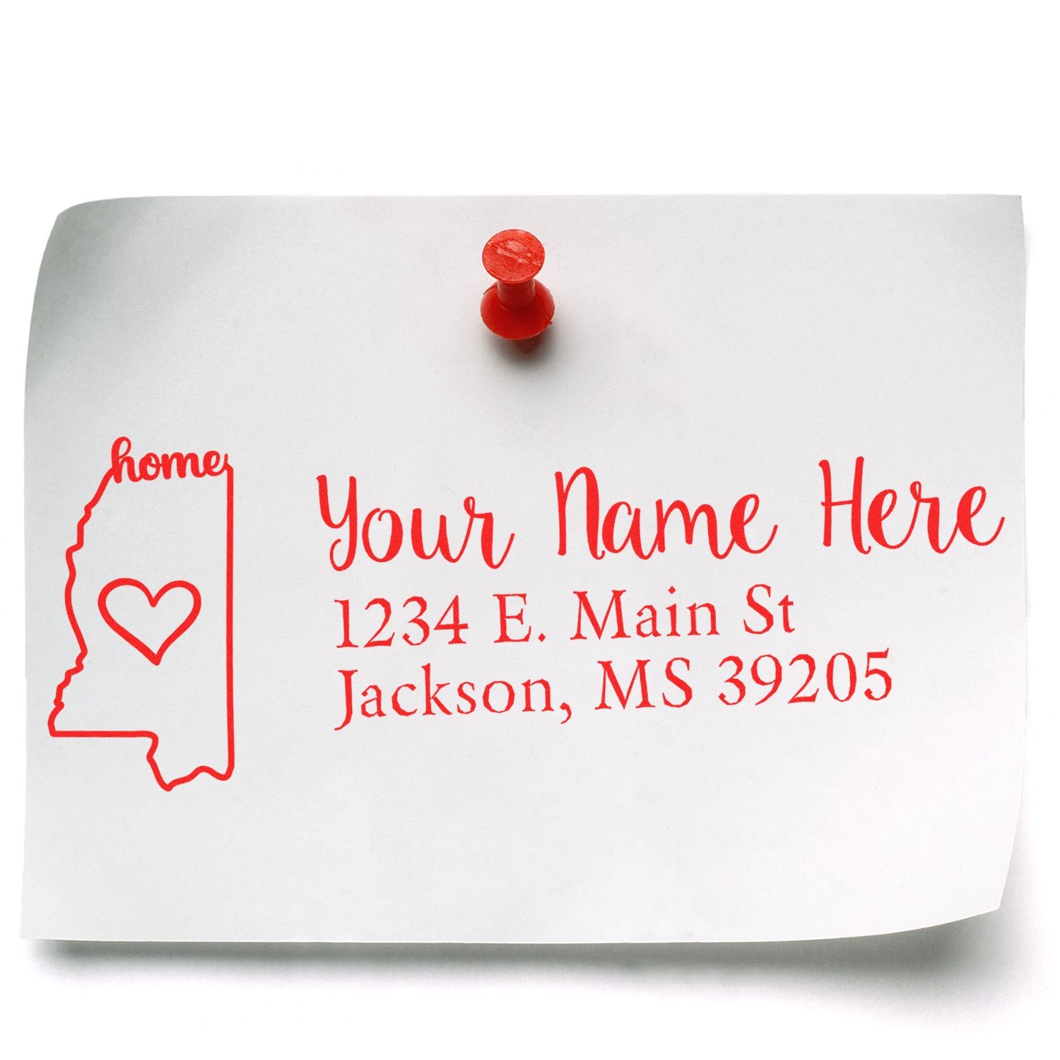 Image of a white paper pinned to a board, featuring a red Mississippi Self-Inking State Love Address Stamp design with a heart inside the state outline and customizable address text.