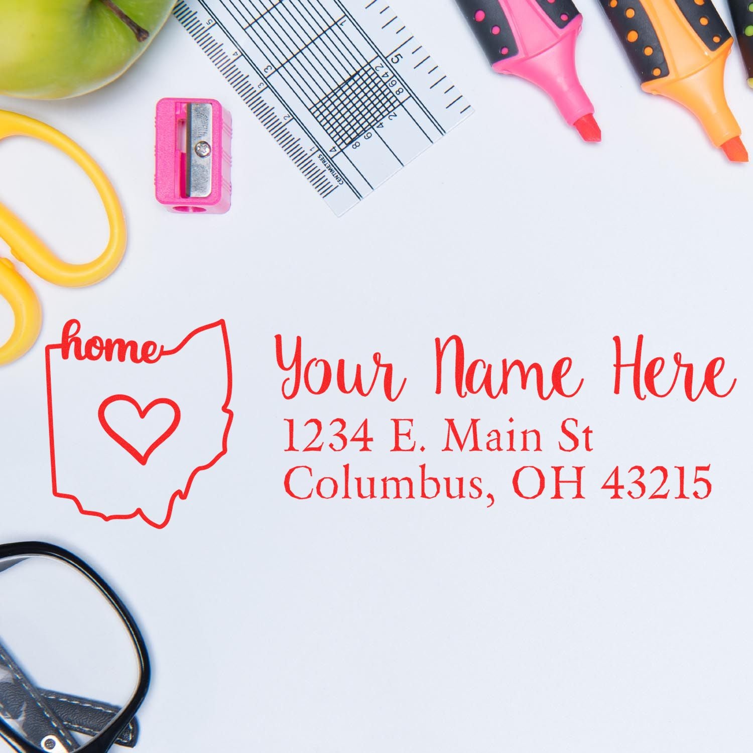 PSI Pre-Inked Personalized Ohio State Love Address Stamp on a desk with stationery items, featuring a red outline of Ohio with a heart and customizable address text.