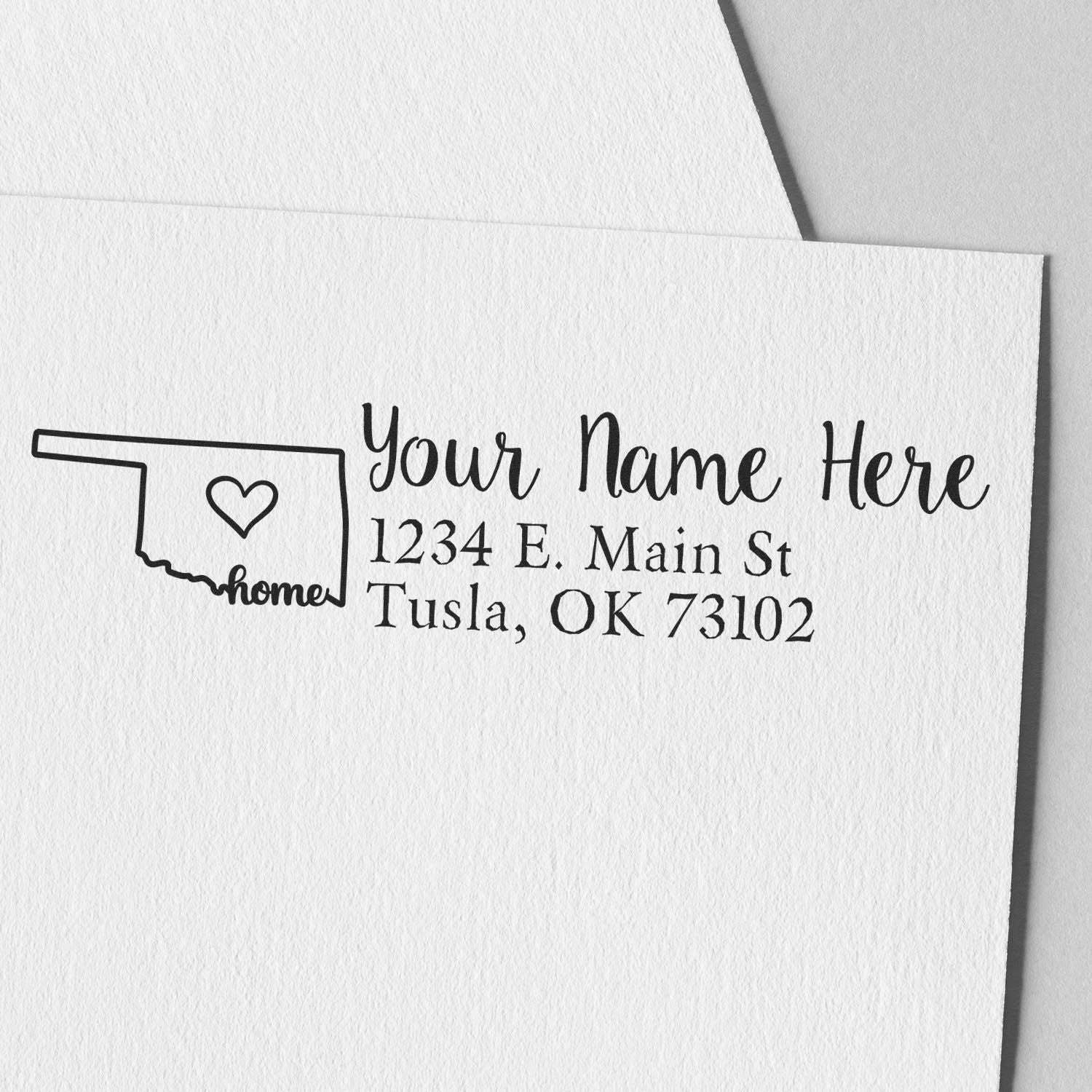 Wood Handle Oklahoma Custom Address Rubber Stamp on white paper, featuring a heart inside the state outline and customizable address text in elegant font.