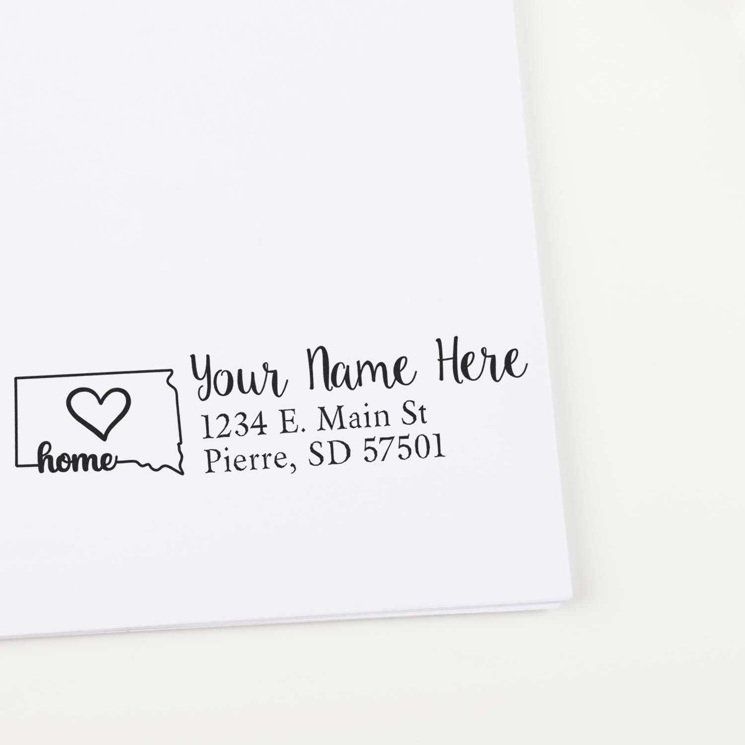 South Dakota Self-Inking State Love Address Stamp on white paper, featuring a heart design within the state outline and customizable address text.