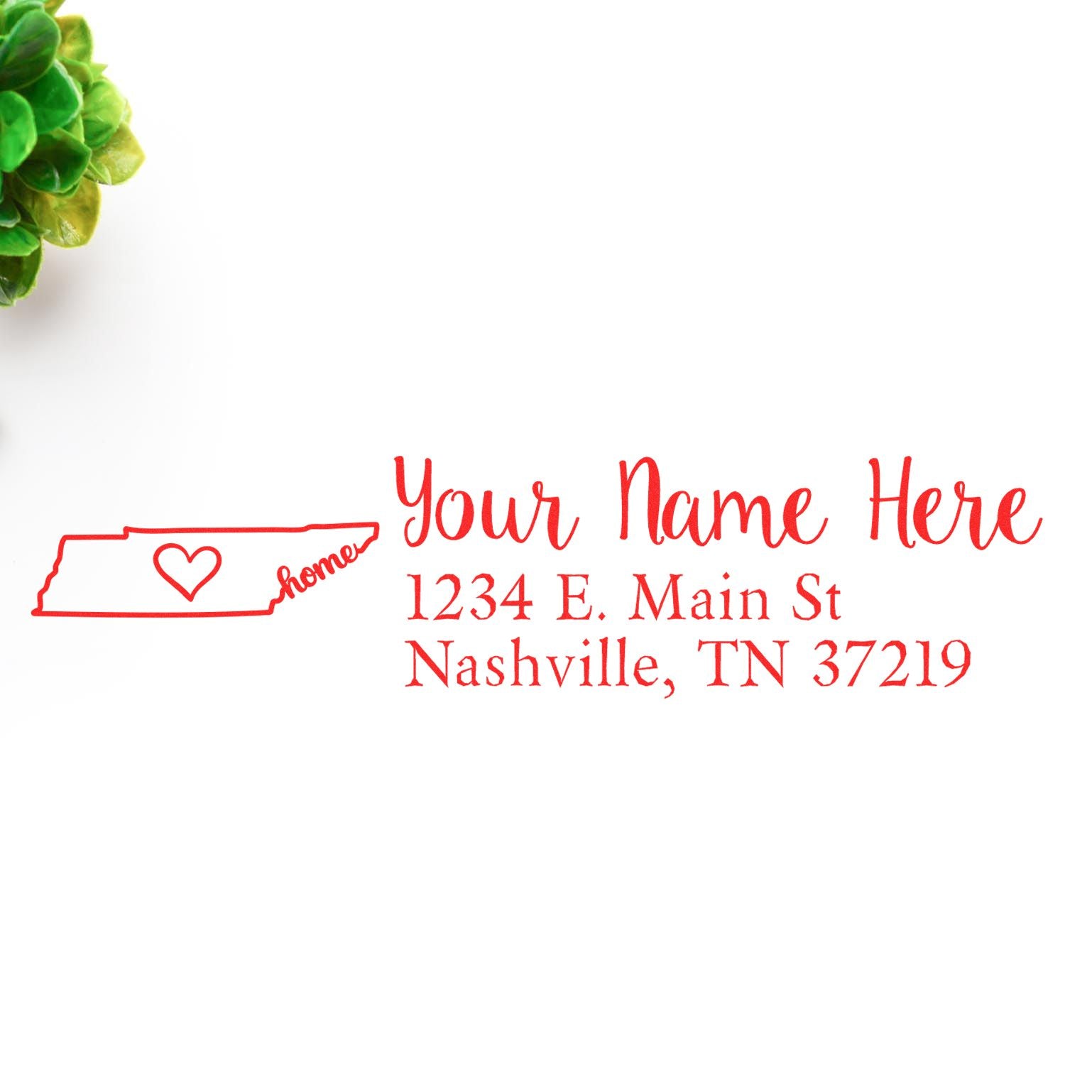 Wood Handle Tennessee Custom Address Rubber Stamp with a red design featuring a heart and Home inside the state outline. Personalized address text beside a small green plant on a white background.