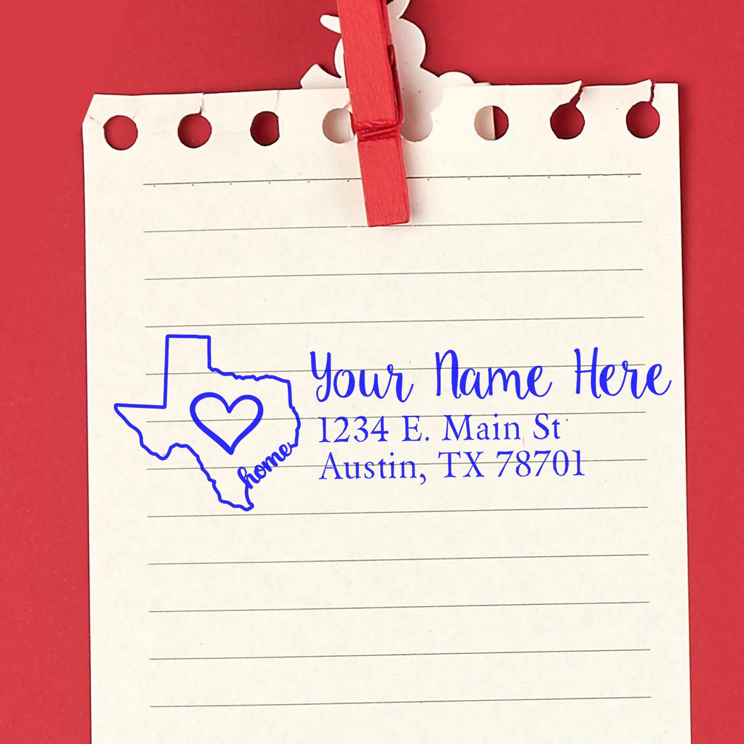 Wood Handle Texas Custom Address Rubber Stamp on notepad with red clip, featuring a Texas outline, heart, and sample address: 1234 E. Main St, Austin, TX 78701 in blue ink.