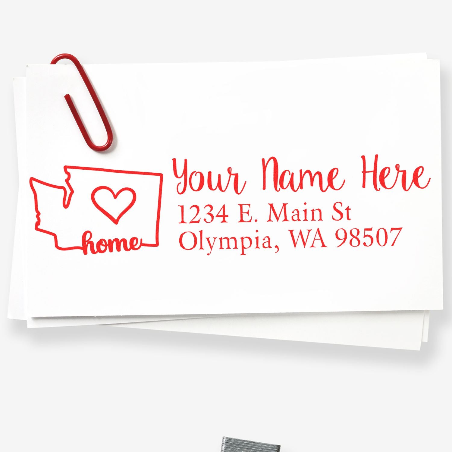 Image of the PSI Pre-Inked Personalized Washington State Love Address Stamp on white paper, featuring a red outline of Washington state with a heart and the word home, alongside customizable address text.