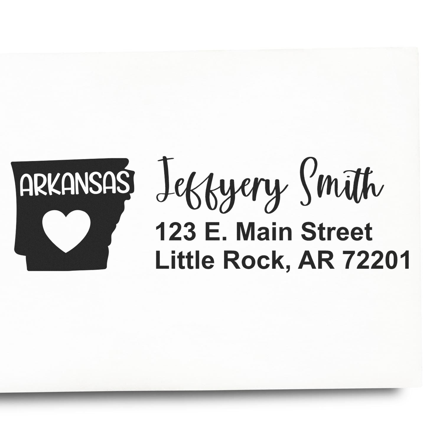 PSI Pre-Inked Arkansas State Love Customized Address Stamp on white paper, featuring a heart within the state outline and personalized address details in elegant font.