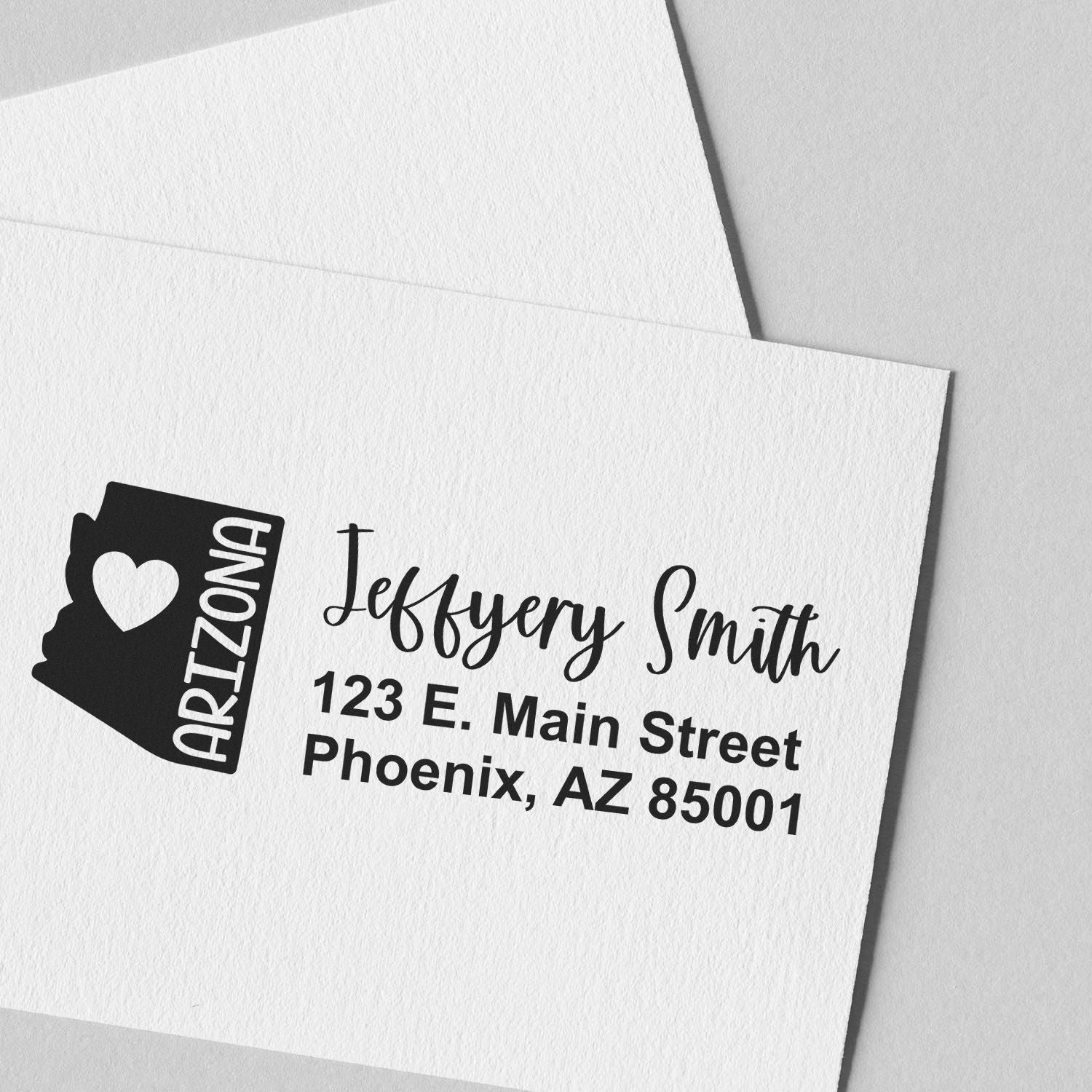 PSI Pre-Inked Arizona State Love Customized Address Stamp on white paper, featuring a heart and Arizona design with the name Jeffery Smith and an address in Phoenix, AZ.