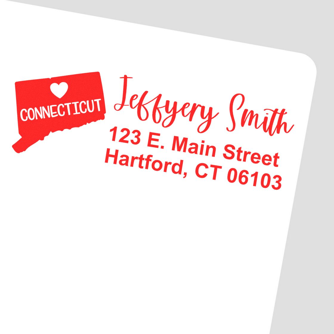 Red ink stamp on white paper featuring Connecticut State Love Personalized Address Stamp with a heart, state outline, and sample address: Jeffery Smith, 123 E. Main Street, Hartford, CT 06103.