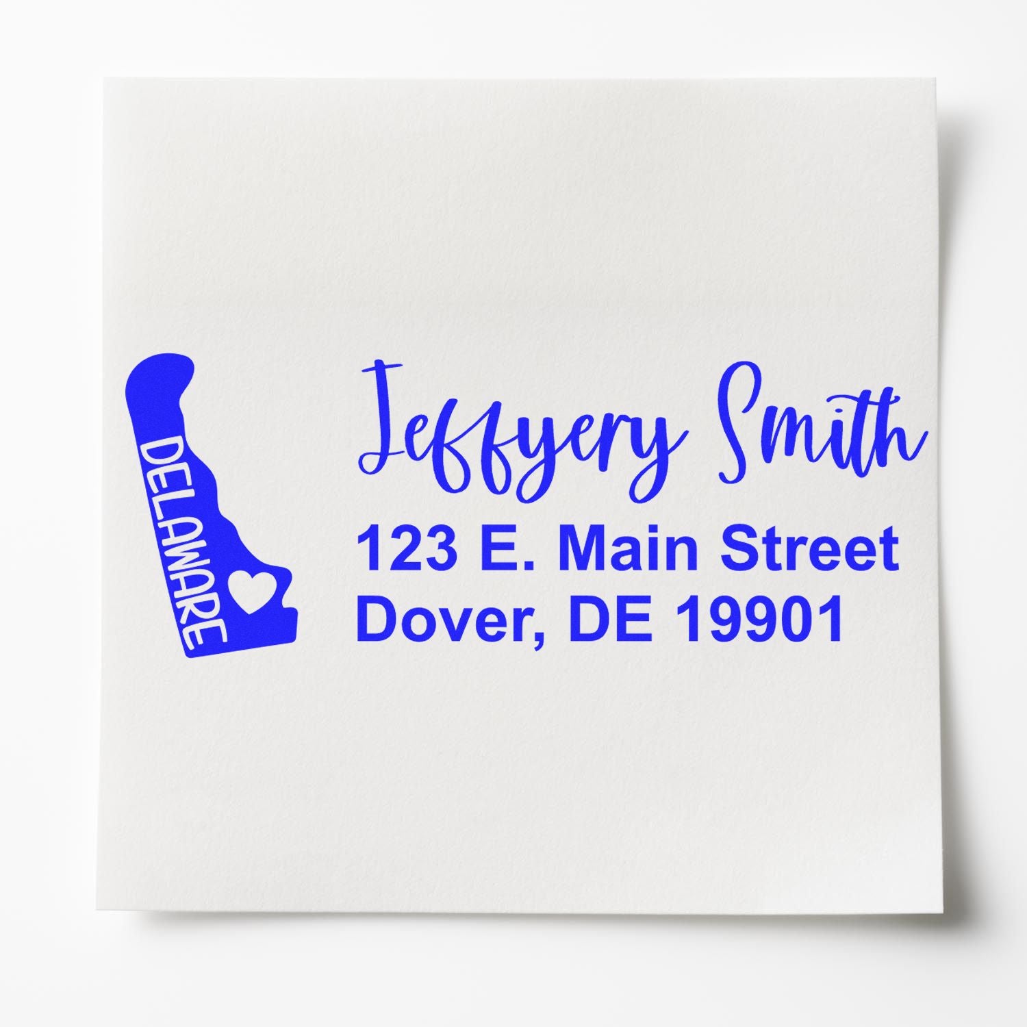 PSI Pre-Inked Delaware State Love Customized Address Stamp on white paper, featuring a blue Delaware state outline with a heart and personalized address in elegant script.