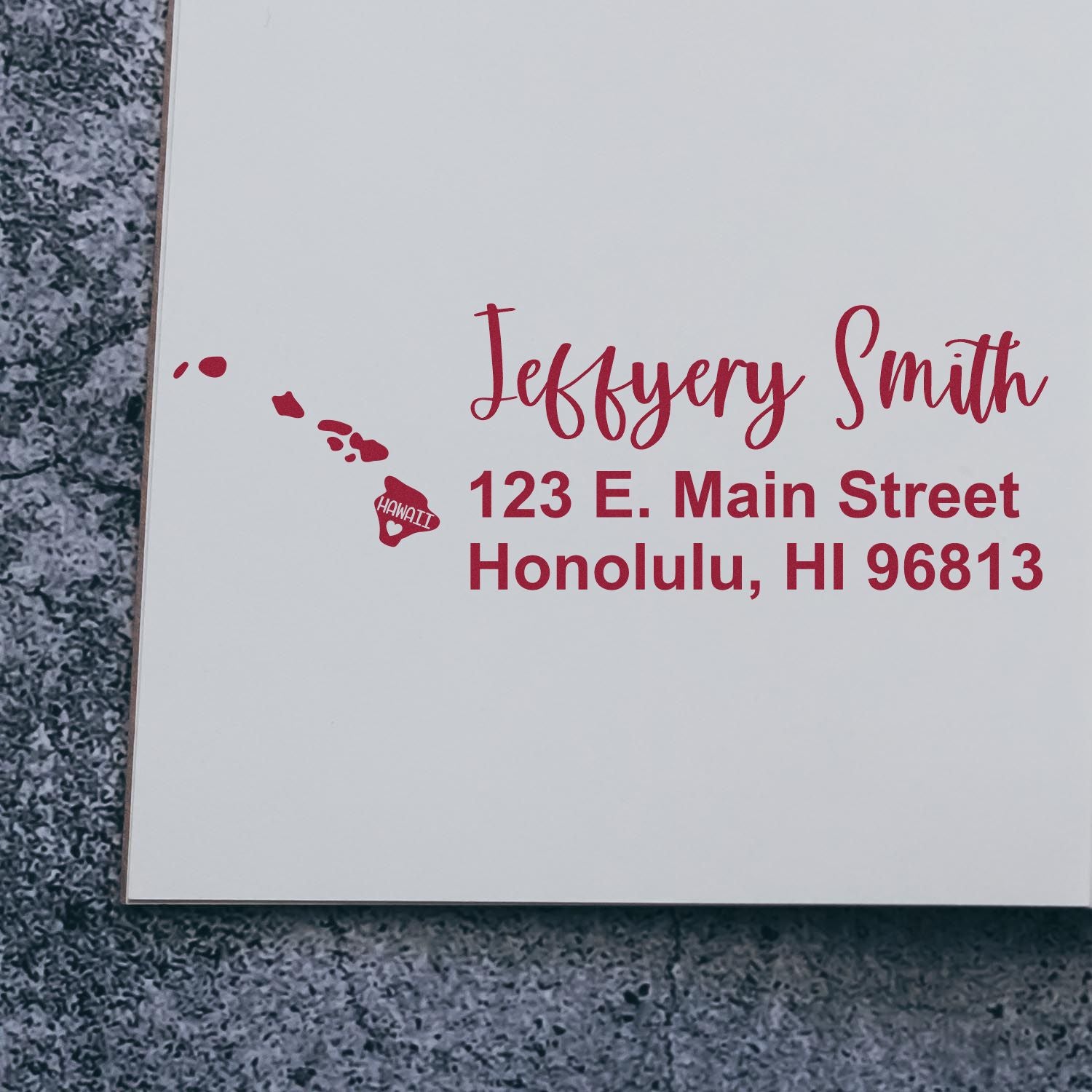 PSI Pre-Inked Hawaii State Love Customized Address Stamp on white paper, featuring red text with a heart and Hawaii map design, displaying Jeffery Smith, 123 E. Main Street, Honolulu, HI 96813.