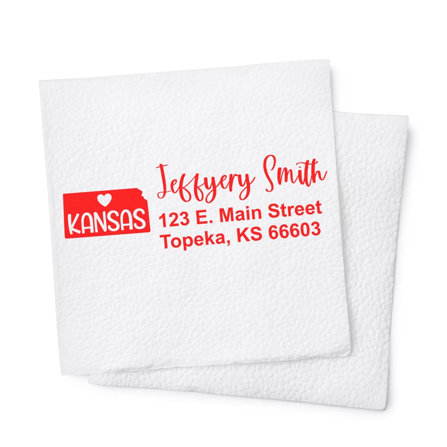 Kansas State Love Personalized Address Stamp in red ink on a white napkin, featuring a heart and state outline with the address: 123 E. Main Street, Topeka, KS 66603.