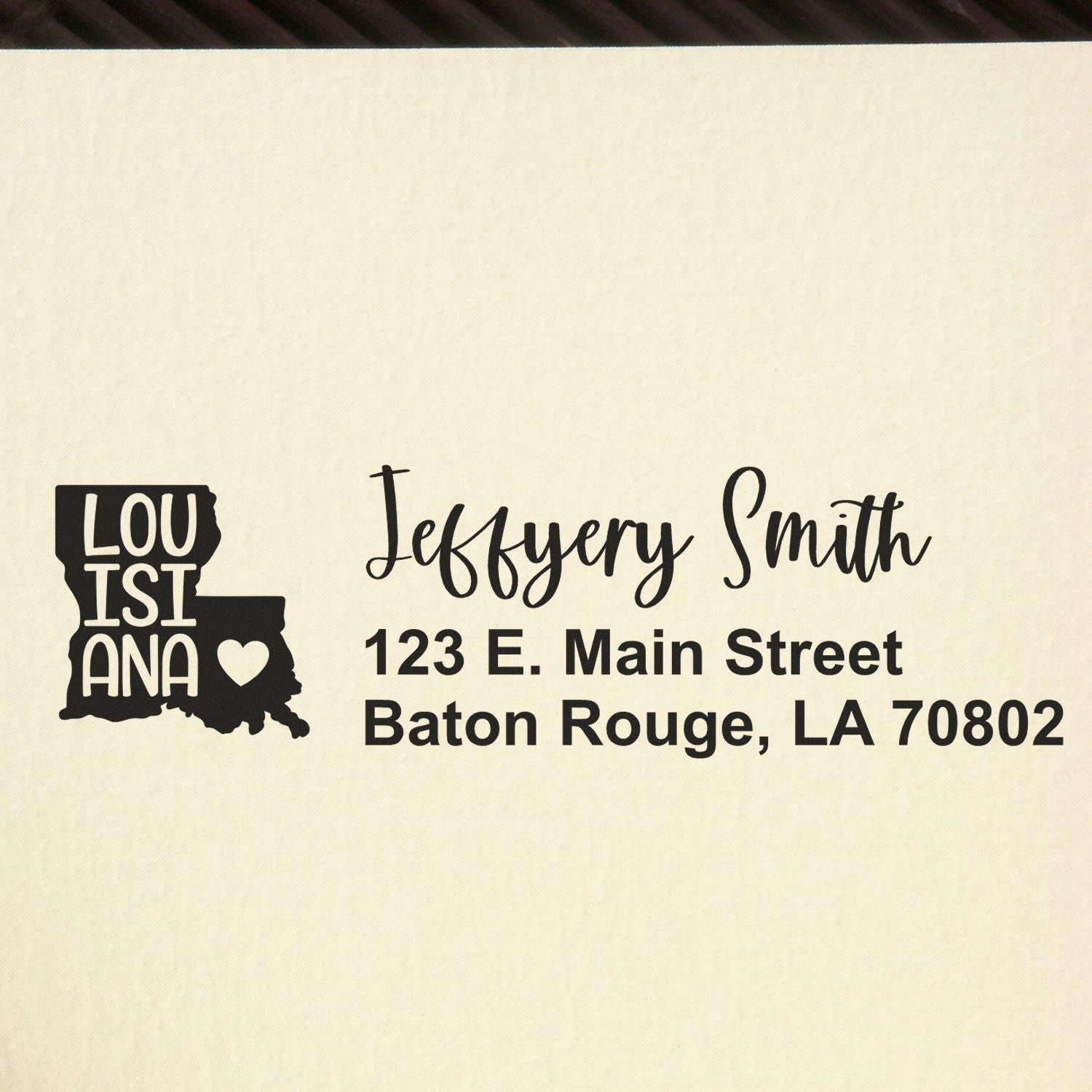 State Love of Louisiana Custom Address Stamp Self-Inking displayed on paper, featuring a Louisiana map with a heart and personalized address in elegant script.