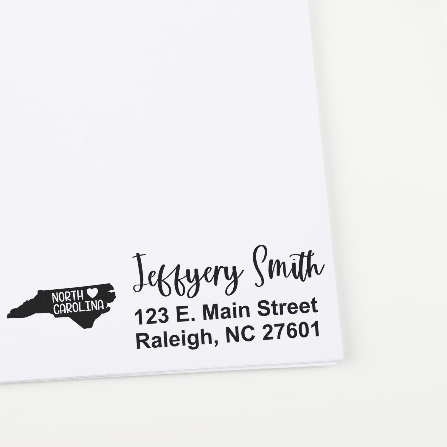 North Carolina State Love Personalized Address Stamp on white paper, featuring a map outline with heart and custom address details in elegant script.