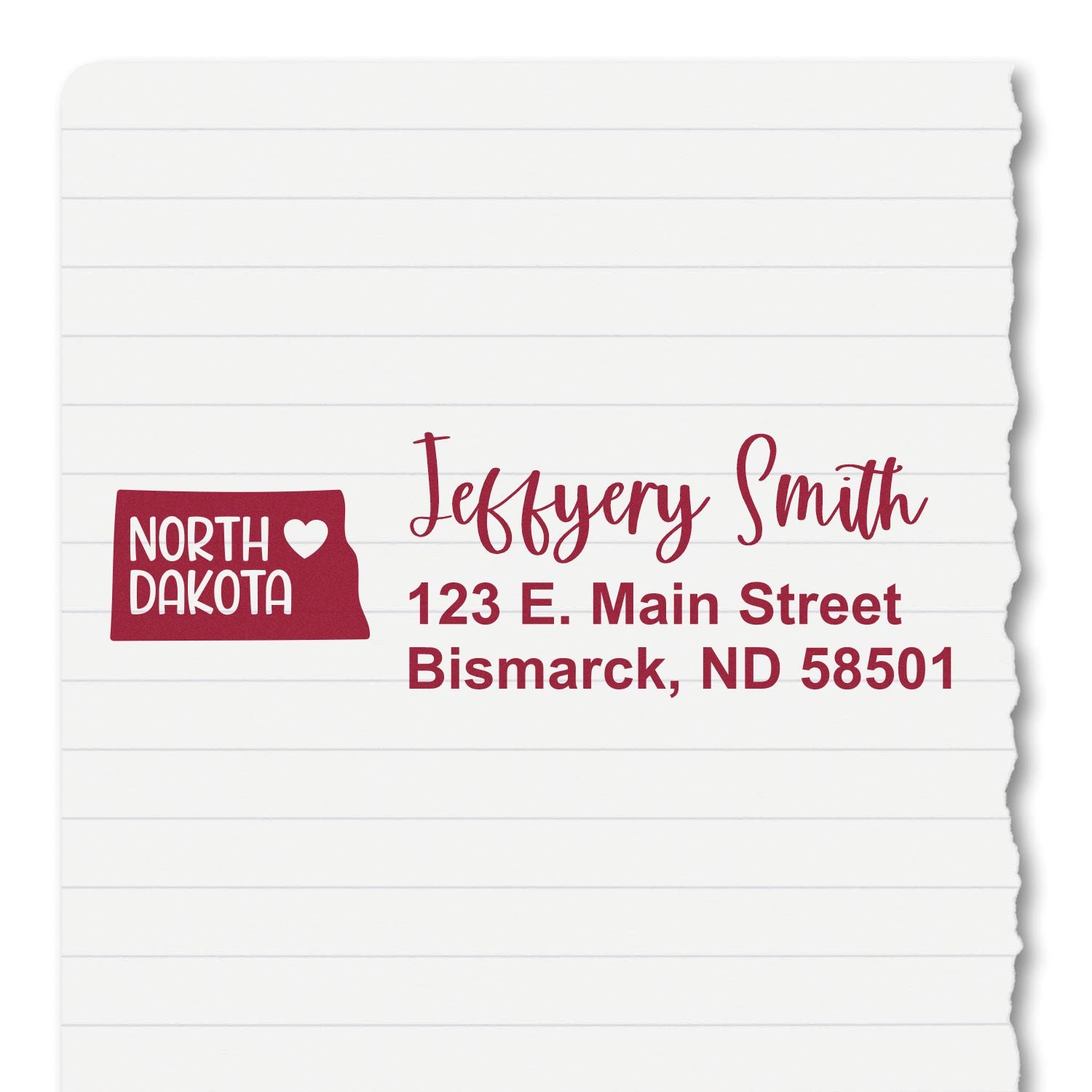 North Dakota State Love Personalized Address Stamp on lined paper, featuring a red state outline with heart, and custom address: Jeffery Smith, 123 E. Main Street, Bismarck, ND 58501.