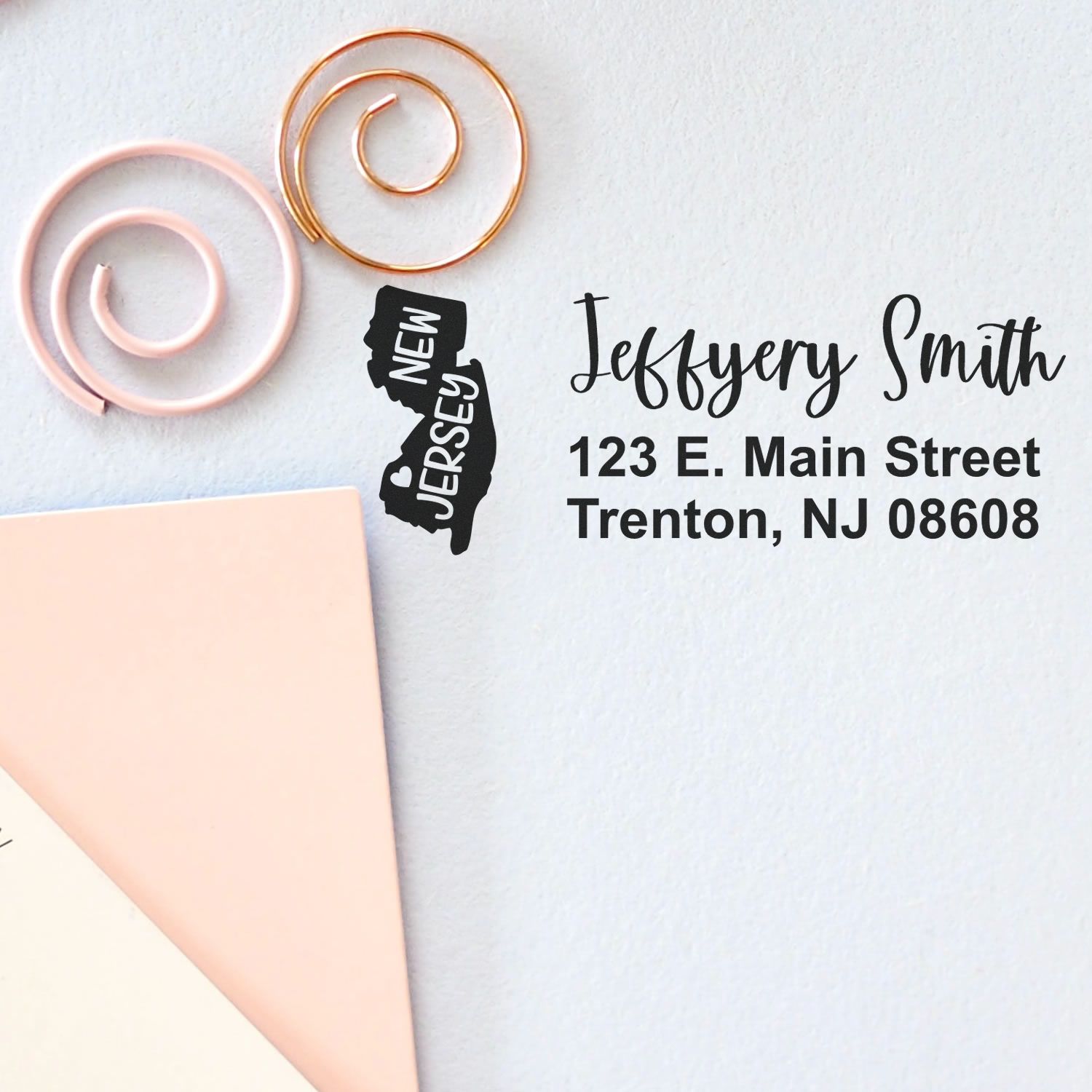 New Jersey State Love Personalized Address Stamp on paper with decorative spirals, featuring a map outline and address: Jeffery Smith, 123 E. Main Street, Trenton, NJ 08608.