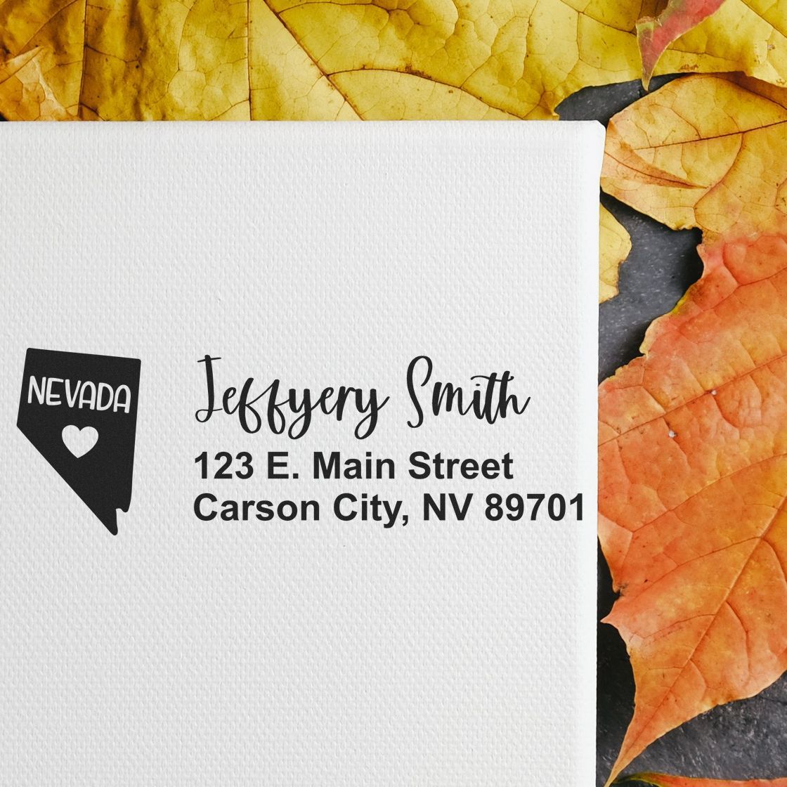 Nevada State Love Personalized Address Stamp on white paper with autumn leaves background, featuring a Nevada map design and custom address text.