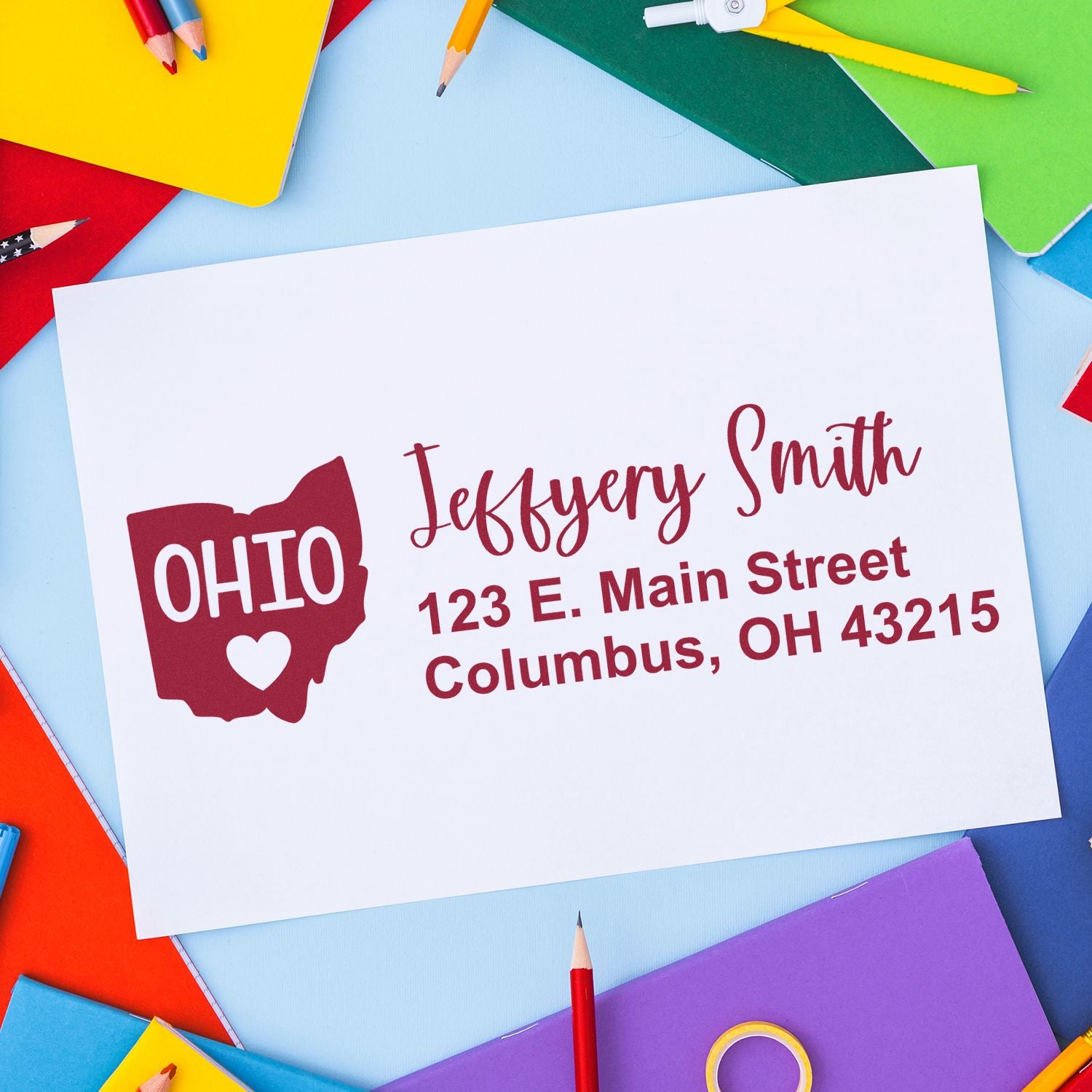 Ohio State Love Personalized Address Stamp on colorful paper background, featuring Jeffery Smith, 123 E. Main Street, Columbus, OH 43215 with Ohio map and heart design.