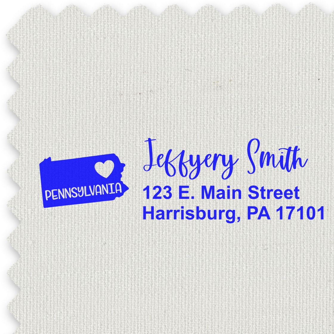 PSI Pre-Inked Pennsylvania State Love Customized Address Stamp on fabric, featuring a blue Pennsylvania state outline with a heart and personalized address in elegant script.