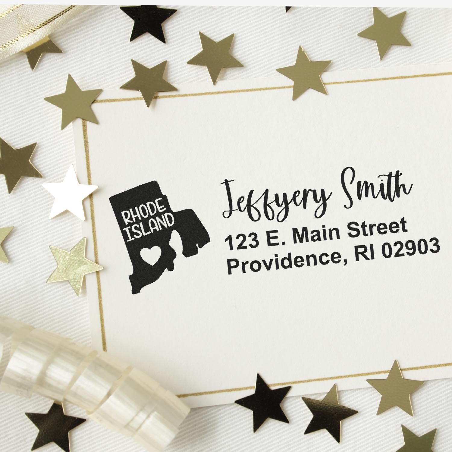 State Love of Rhode Island Custom Address Stamp Self-Inking on a card with gold stars and ribbon, featuring a map outline and address in elegant font.