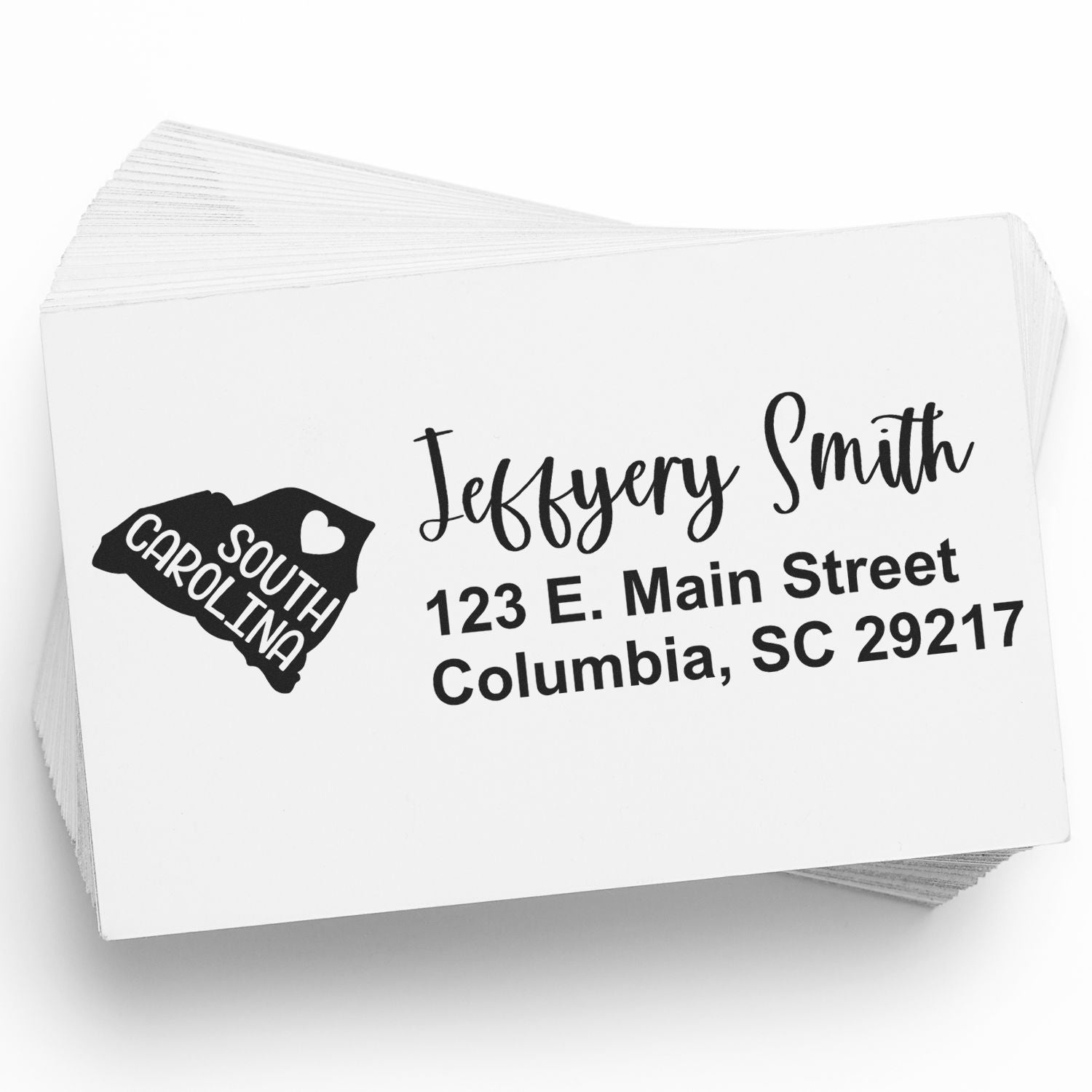 South Carolina State Love Personalized Address Stamp on a stack of envelopes, featuring a heart and state outline, with the name Jeffery Smith and address in bold, elegant font.